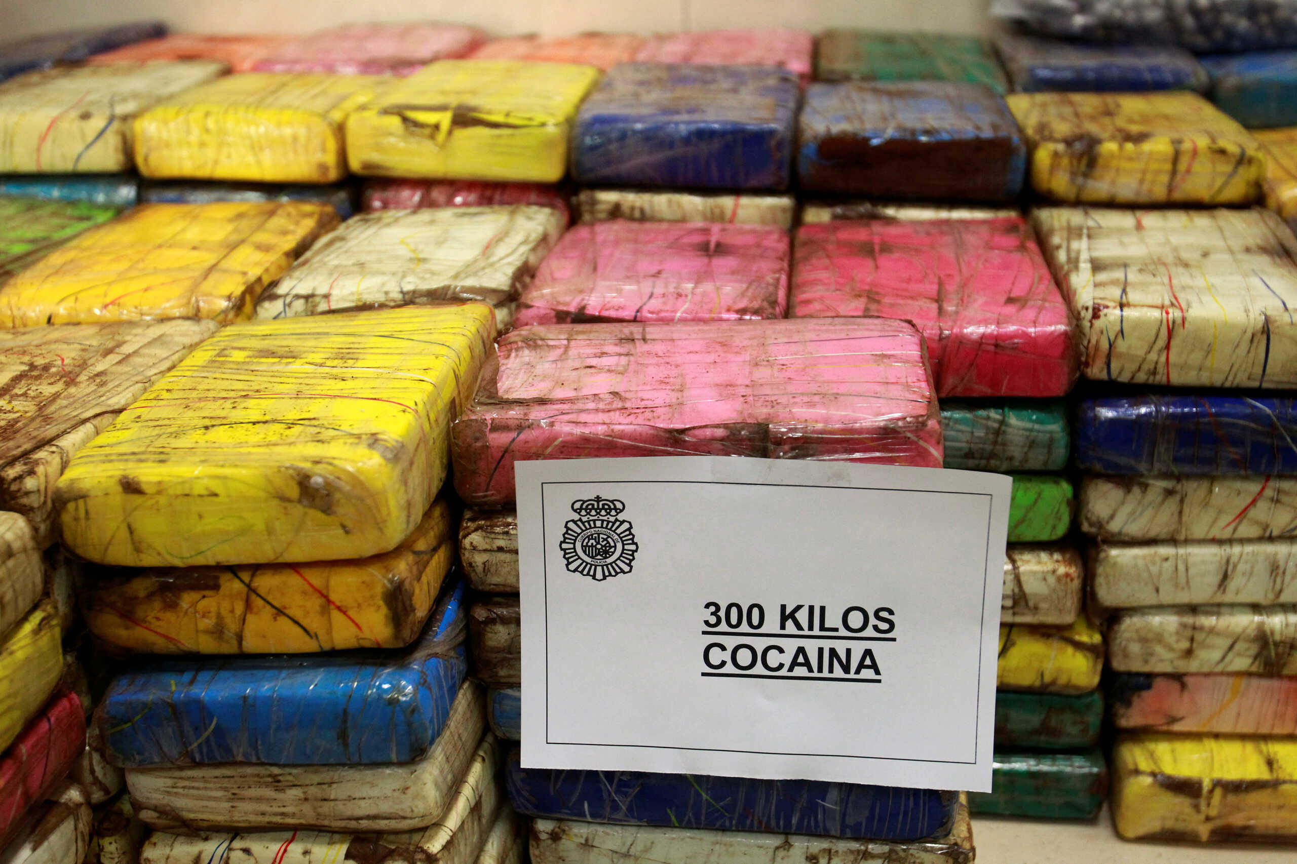 FILE PHOTO: Packages of confiscated cocaine weighing 300 kilograms (661 pounds) are displayed at a police headquarter in Madrid January 18, 2011.  REUTERS