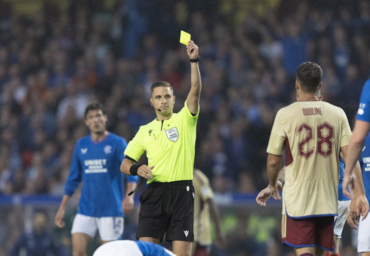epa10792449 Servette's David Douline is sent off by Referee Donatas Rumsas for a second booking during the UEFA Champions League 3rd qualifying round, 1st leg match between Glasgow Rangers and Servette in Glasgow, 09 August 2023.  EPA