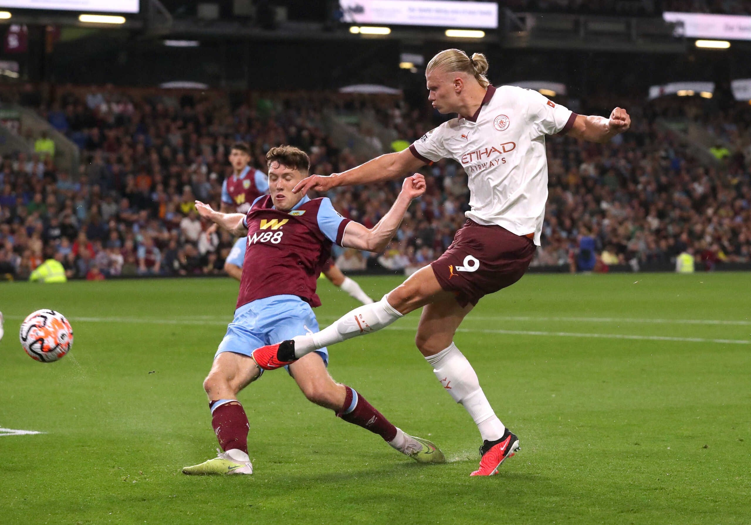 Soccer Football - Premier League - Burnley v Manchester City - Turf Moor, Burnley, Britain - August 11, 2023 Manchester City's Erling Braut Haaland in action with Burnley's Dara O'Shea REUTERS