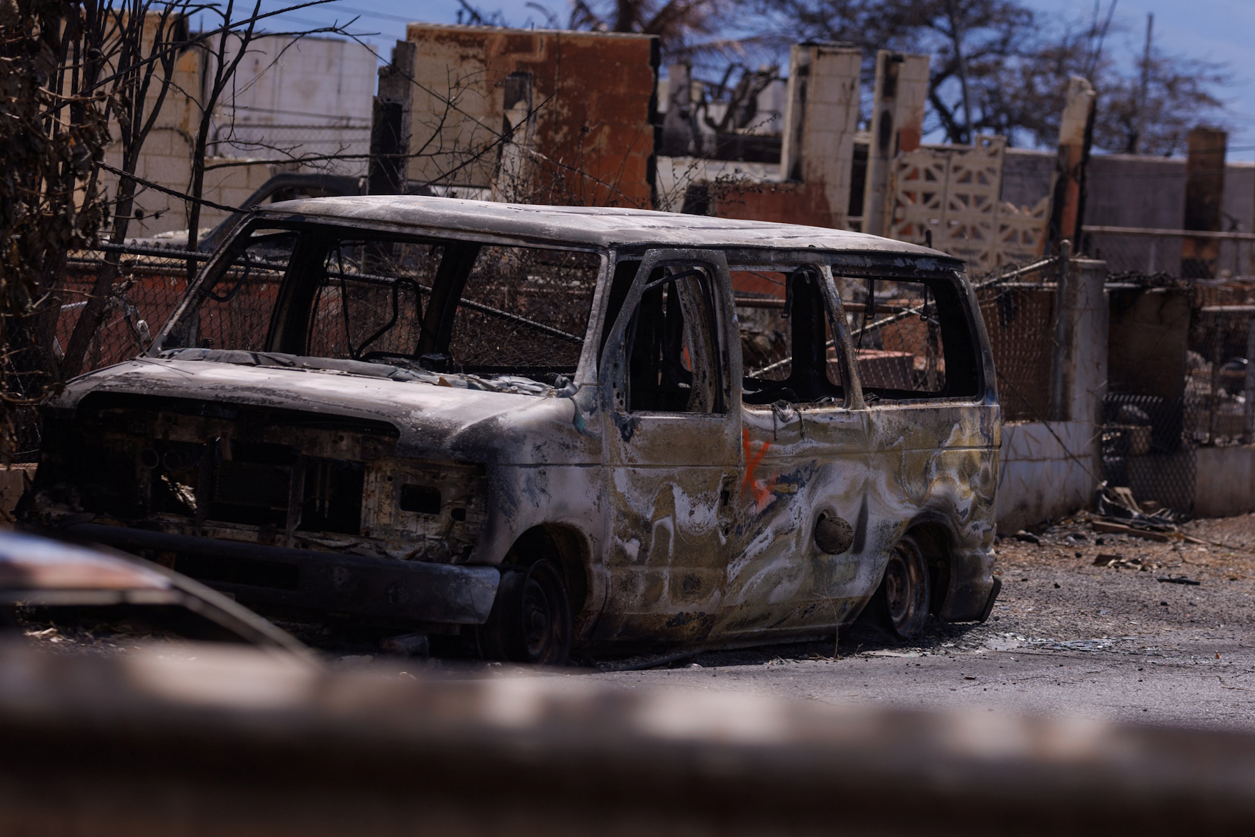 A damaged vehicle is pictured in the fire ravaged town of Lahaina on the island of Maui in Hawaii, U.S., August 15, 2023.  REUTERS
