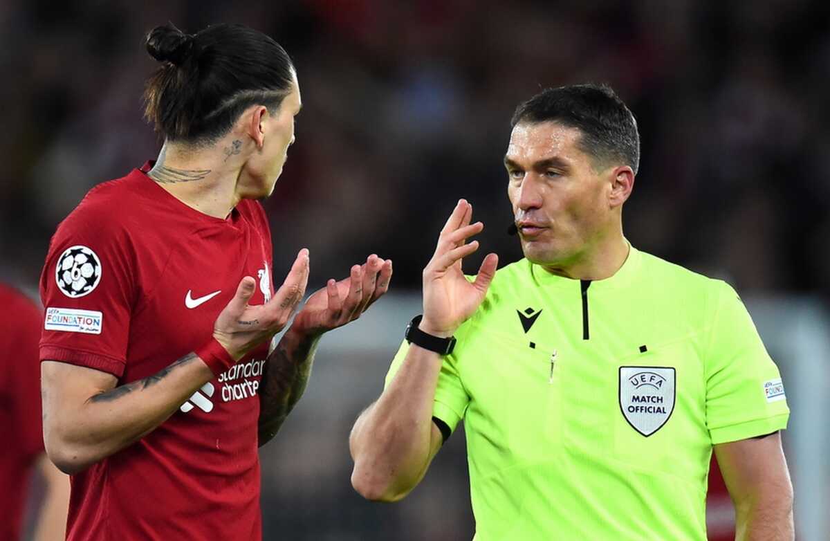 epa10482656 Referee Istvan Kovacs talks to Darwin Nunez of Liverpool during the UEFA Champions League, Round of 16, 1st leg match between Liverpool FC and Real Madrid in Liverpool, Britain, 21 February 2023.  EPA