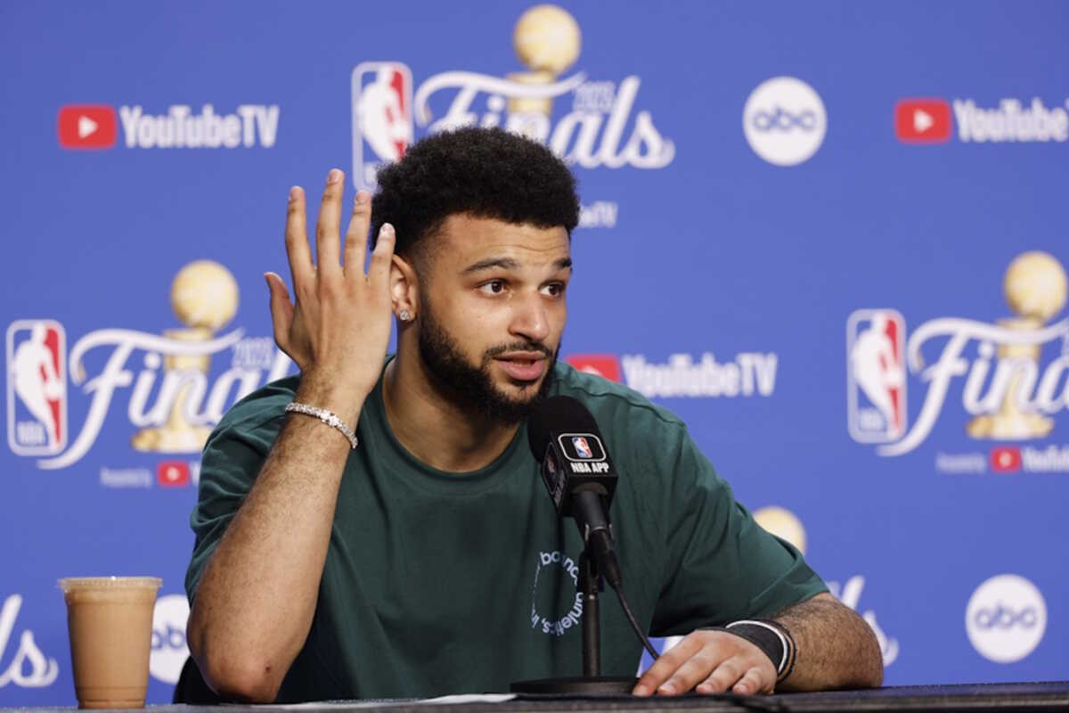 epa10682761 Denver Nuggets guard Jamal Murray responds to a question during a press conference after game four of the NBA Finals between the Denver Nuggets and Miami Heat at Kaseya Center in Miami, Florida, USA, 09 June 2023.  EPA