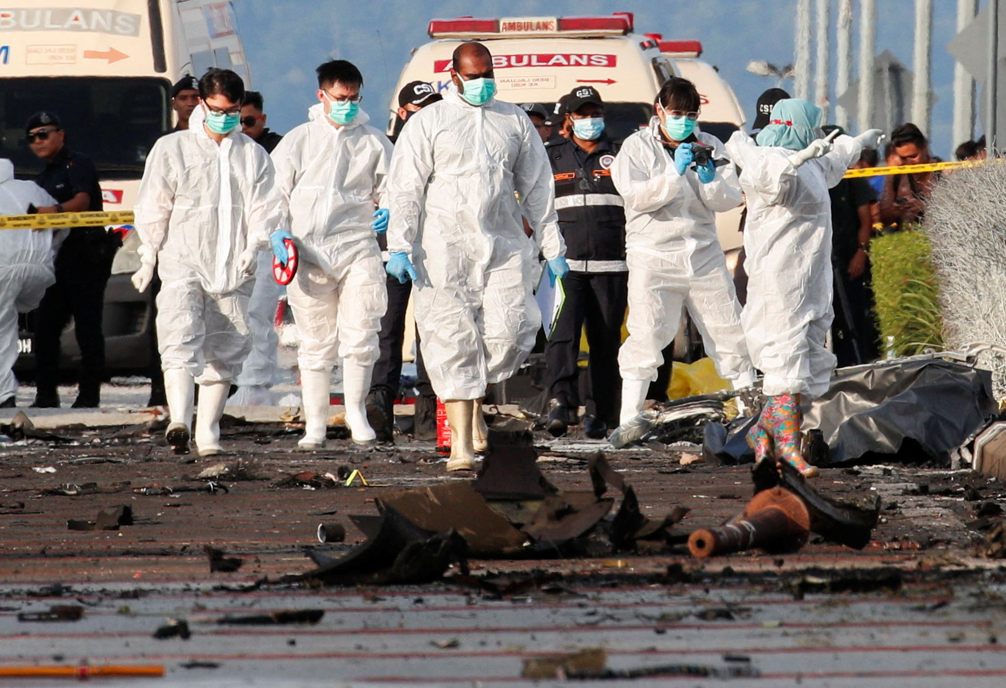 Authorities inspect the scene of a plane crash in Shah Alam, Malaysia August 17, 2023. REUTERS