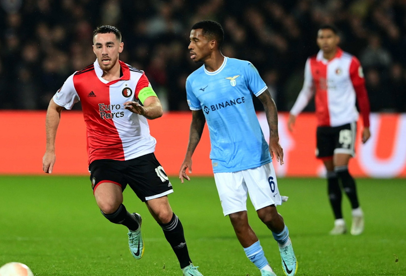 epa10284322 (L-R) Orkun Kokcu of Feyenoord, Marcos Antonio of Lazio Roma during the UEFA Europa League Group F match between Feyenoord and Lazio Roma at Feyenoord Stadion de Kuip in Rotterdam, Netherlands, 03 November 2022.  EPA