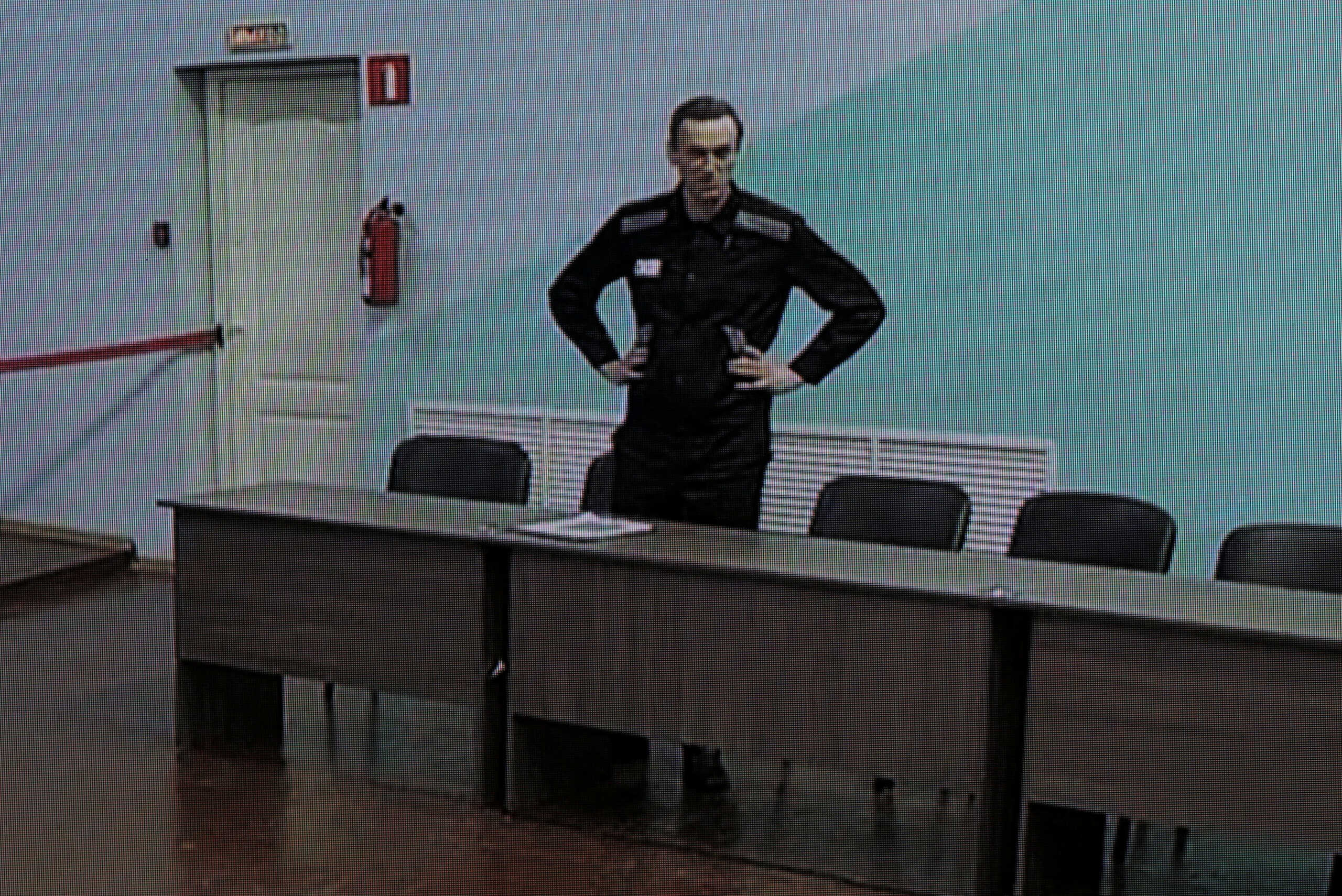 Russian opposition politician Alexei Navalny appears on a screen via video link before an external hearing of the Moscow City Court in the criminal case against him on numerous charges, including the creation of an extremist organization, at the IK-6 penal colony in Melekhovo in the Vladimir region, Russia, August 4, 2023. REUTERS