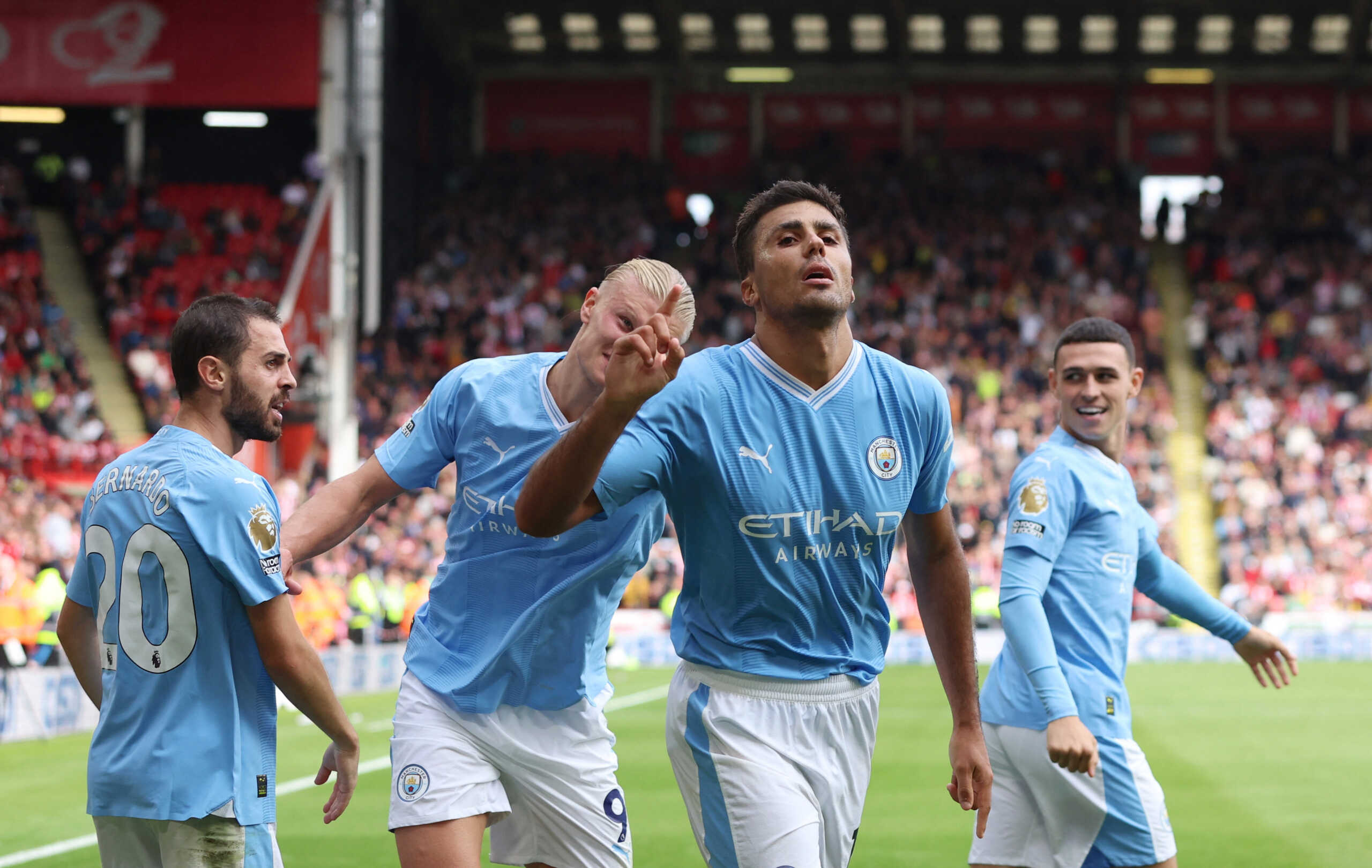 Soccer Football - Premier League - Sheffield United v Manchester City - Bramall Lane, Sheffield, Britain - August 27, 2023 Manchester City's Rodri celebrates scoring their second goal with Bernardo Silva and Erling Braut Haaland REUTERS