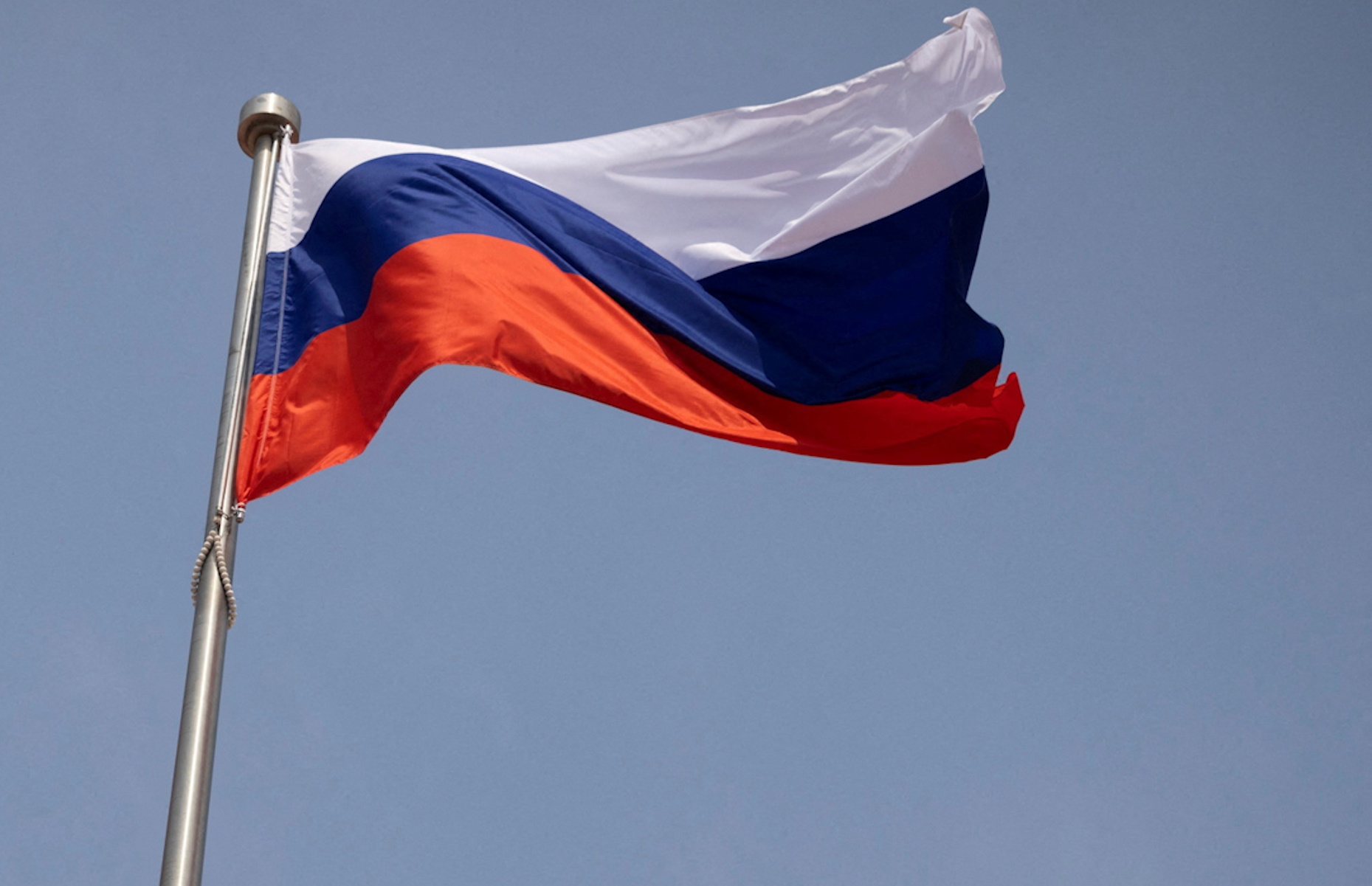 FILE PHOTO: The Russian national flag flies in front of the Great Hall of the People before a welcoming ceremony for Russian Prime Minister Mikhail Mishustin in Beijing, China, May 24, 2023. REUTERS