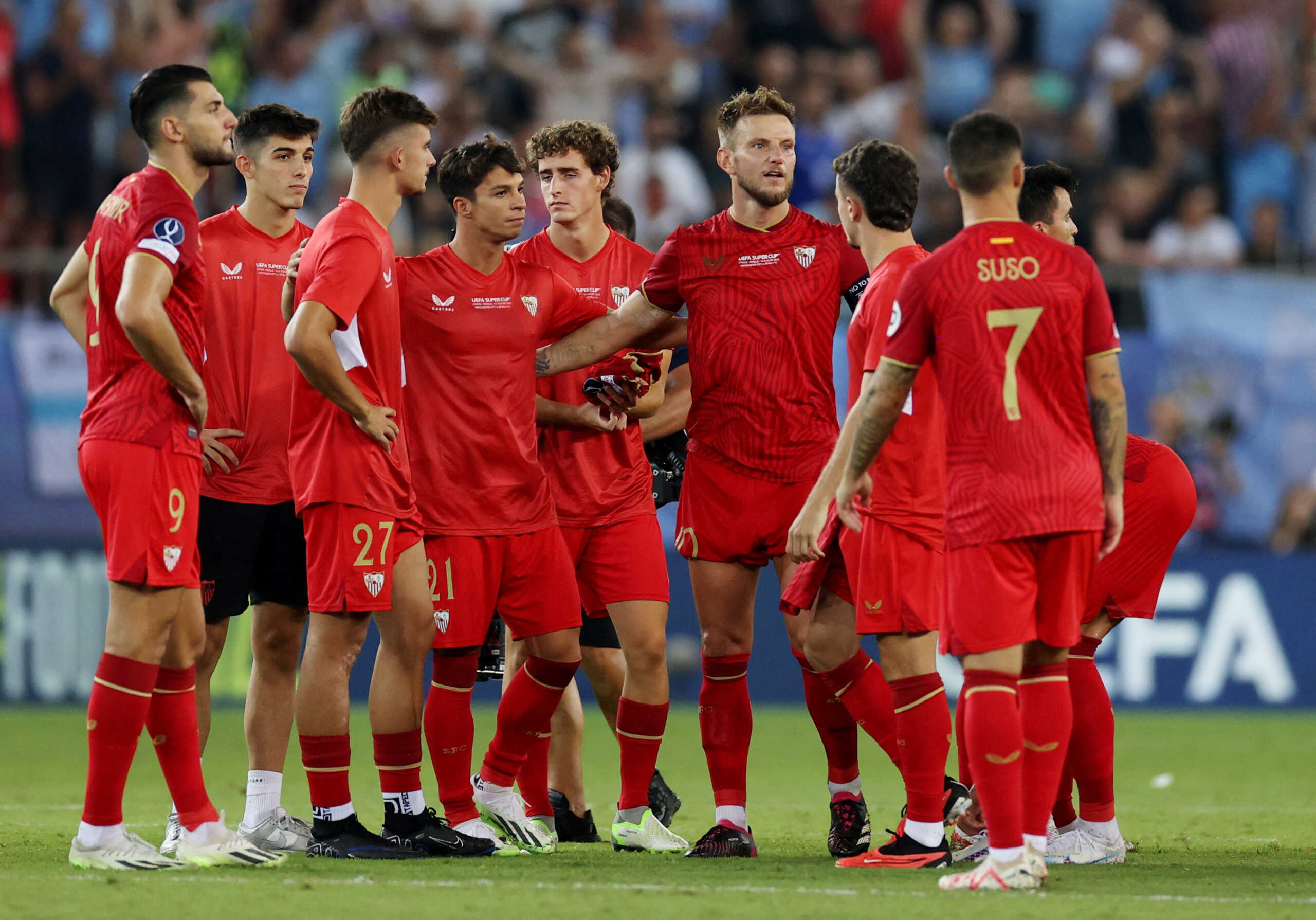 Soccer Football - UEFA Super Cup - Manchester City v Sevilla - Georgios Karaiskakis Stadium, Athens, Greece - August 16, 2023 Sevilla's Ivan Rakitic with teammates look dejected after the match REUTERS