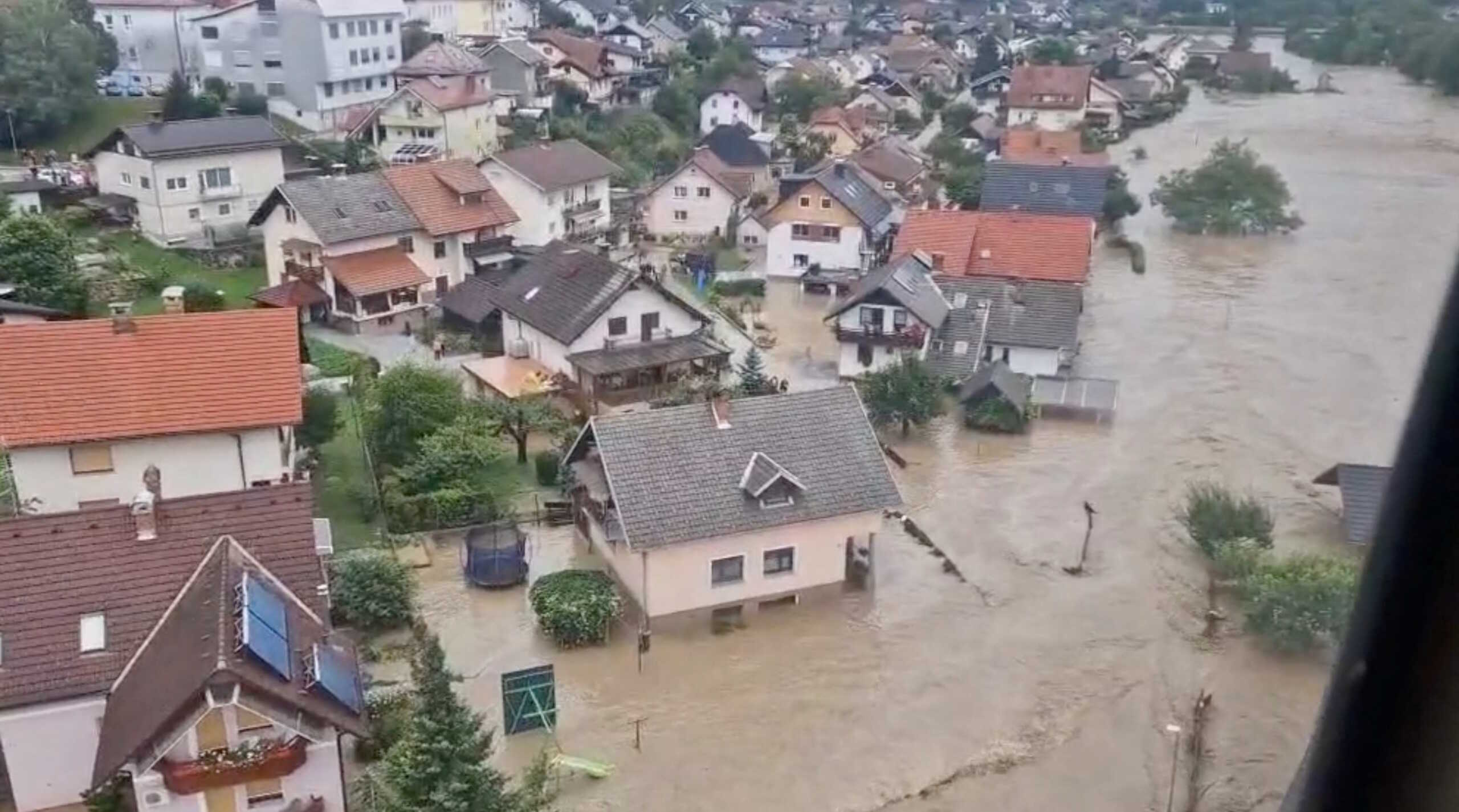 An aerial view shows buildings submerged in floodwaters in Skofja Loka, Slovenia, August 4, 2023 in this screengrab taken from a handout video. Slovenian Army