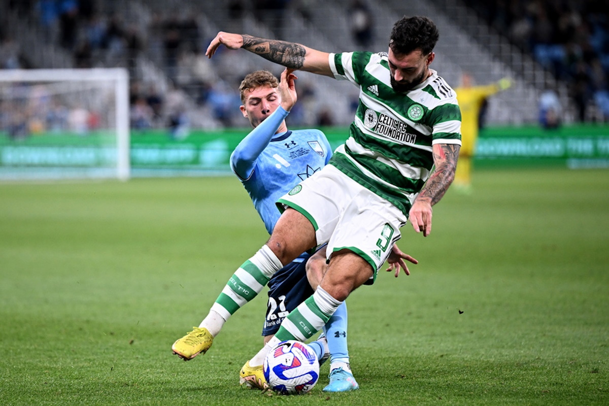 epa10310091 Sead Haksabanovic (R) of Celtic is tackled by Alexander Parsons (L) of Sydney during the Sydney Super Cup exhibition soccer match between Sydney FC and Celtic FC in Sydney, Australia, 17 November 2022.  EPA
