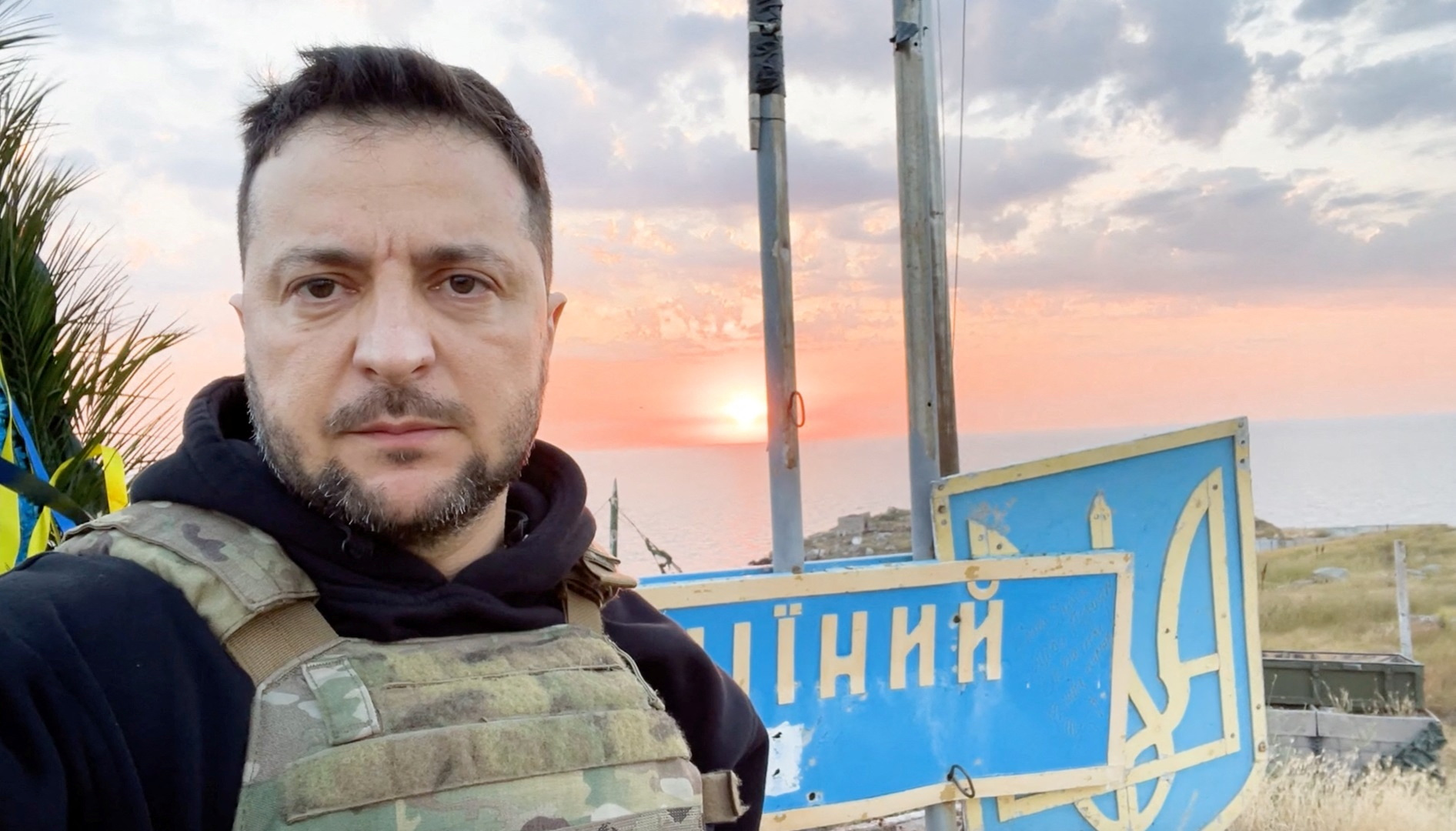 Ukraine's President Volodymyr Zelenskiy takes a picture as he visits Snake (Zmiinyi) Island in the Black Sea, retaken by the Ukrainian Armed Forces a year ago, amid Russia's attack on Ukraine, in Odesa region, Ukraine, in this handout picture released July 8, 2023. Ukrainian Presidential Press Service