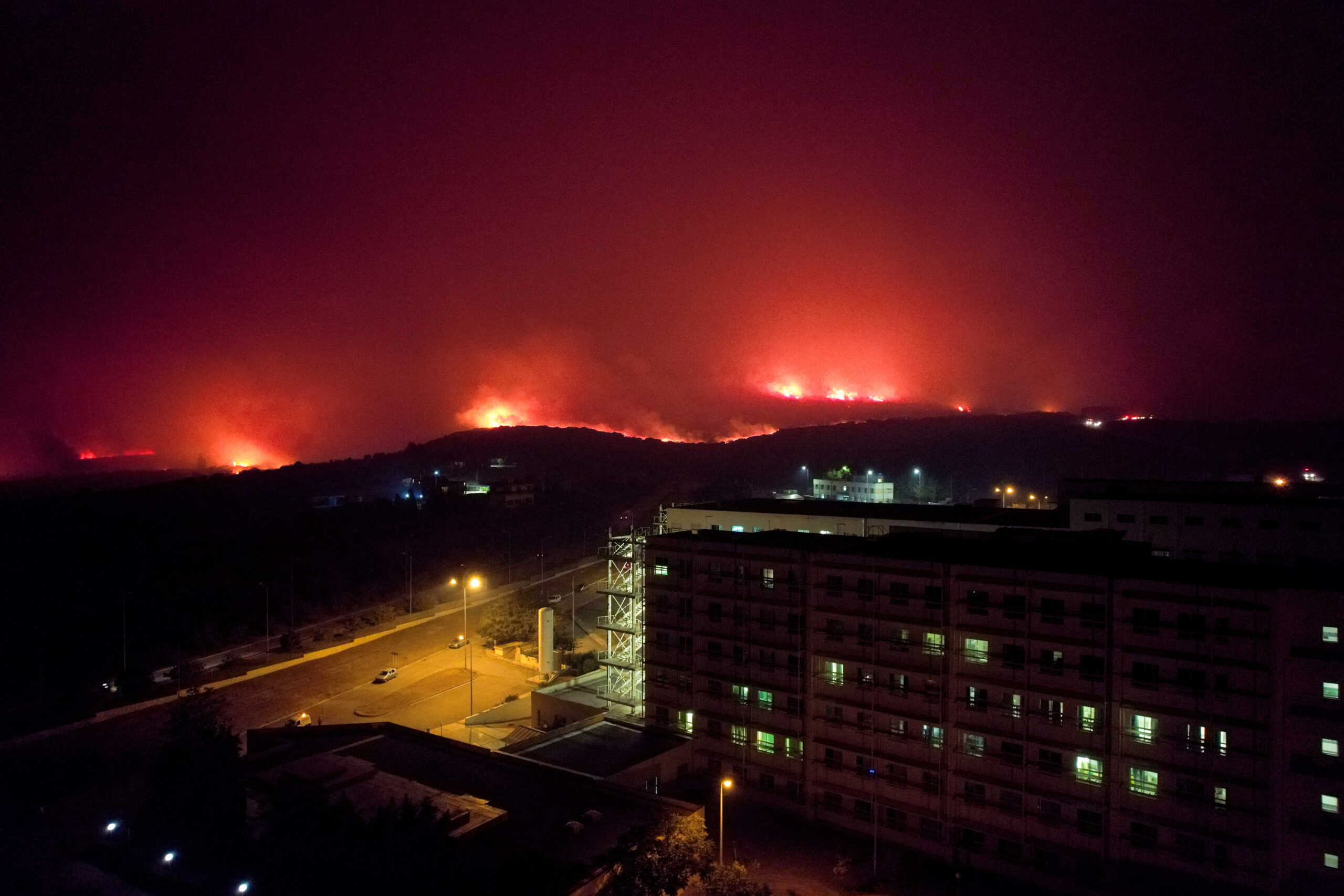 A wildfire burns near a hospital in Alexandroupolis, in the region of Evros, Greece, August 22, 2023. REUTERS