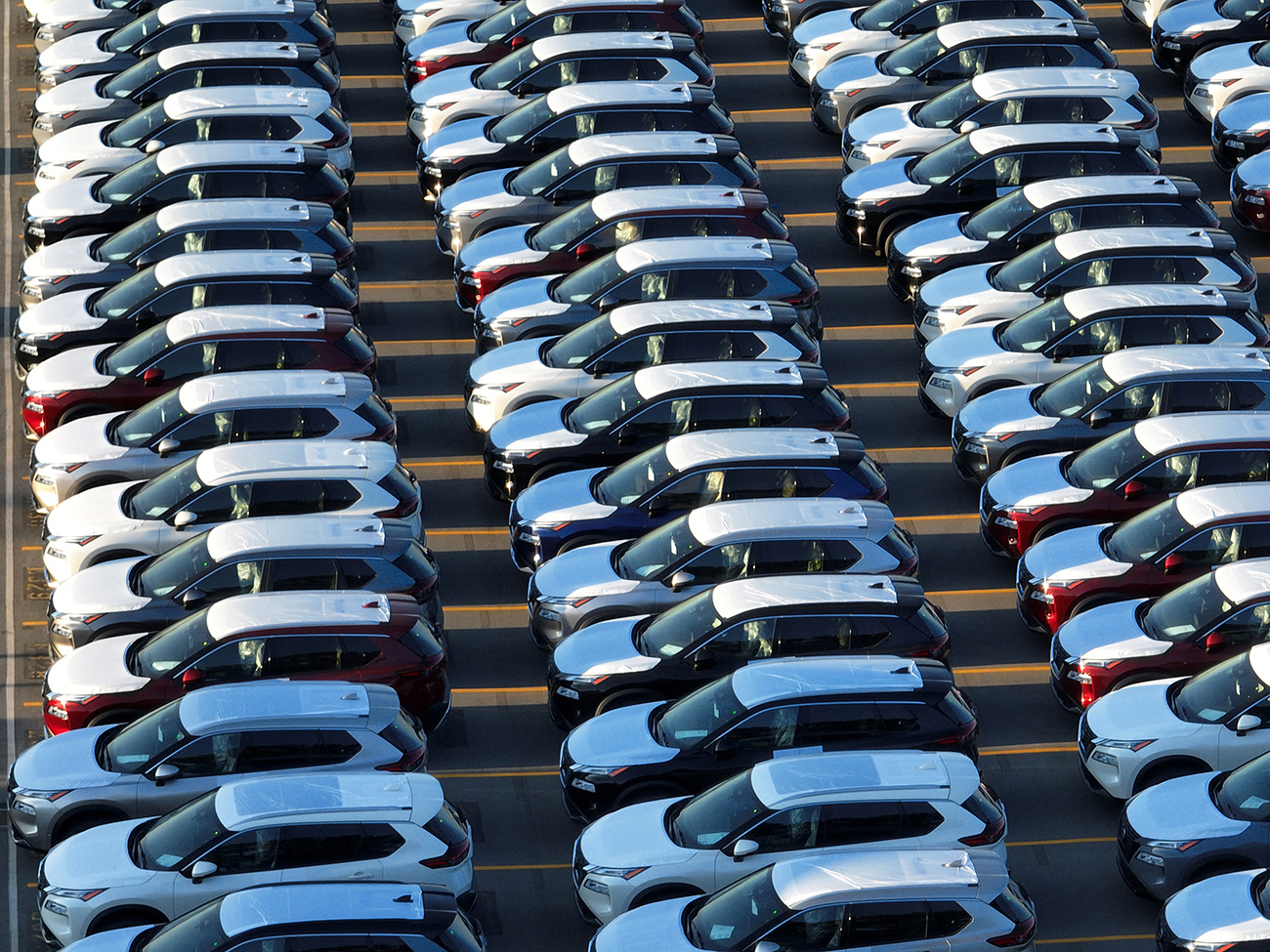 New Nissan cars are parked in rows after arriving by ship at Annacis Island in Delta, British Columbia, Canada, July 31, 2023. REUTERS