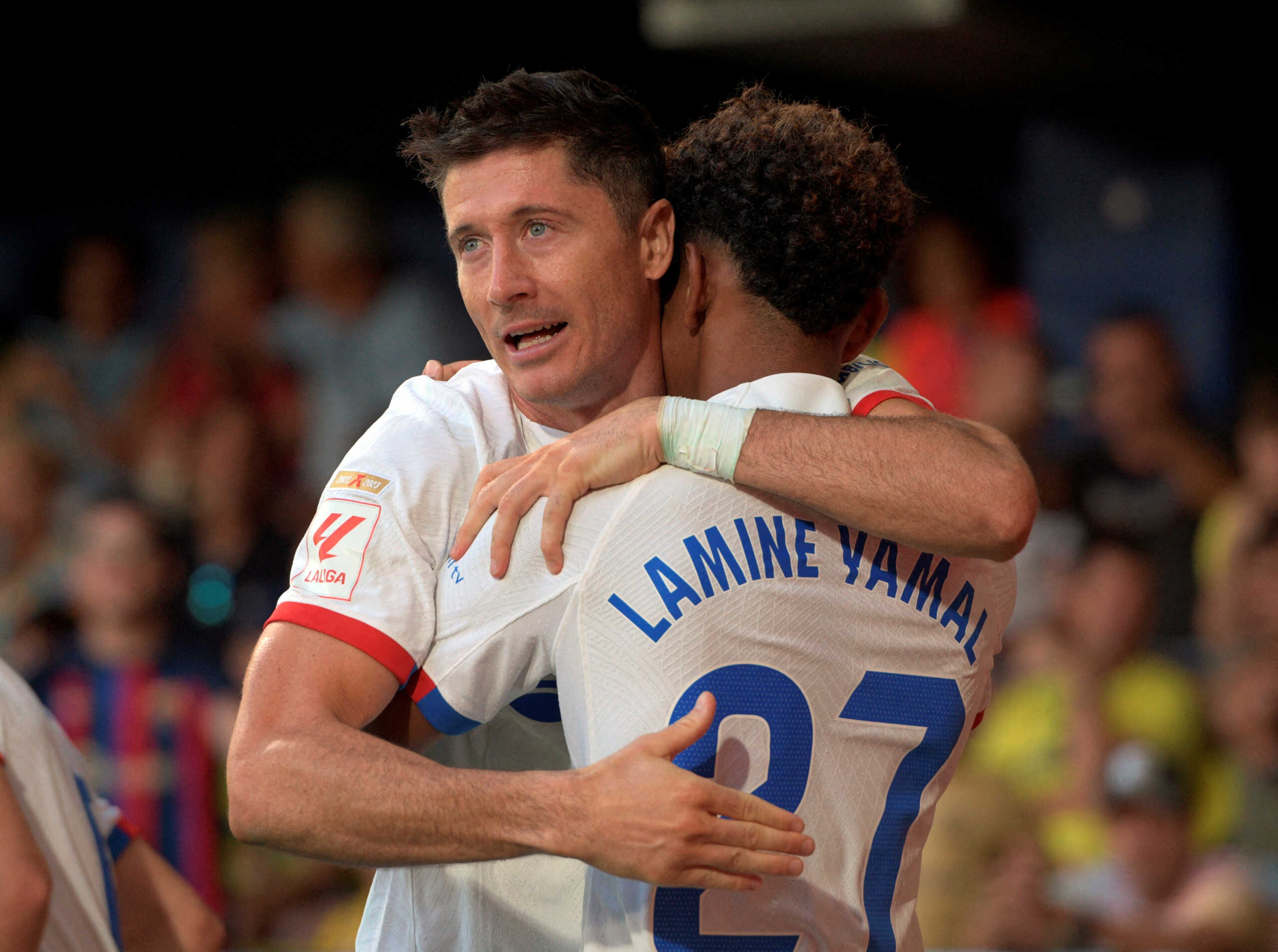Soccer Football - LaLiga - Villarreal v FC Barcelona - Estadio de la Ceramica, Villarreal, Spain - August 27, 2023 FC Barcelona's Robert Lewandowski celebrates scoring their fourth goal with Lamine Yamal REUTERS