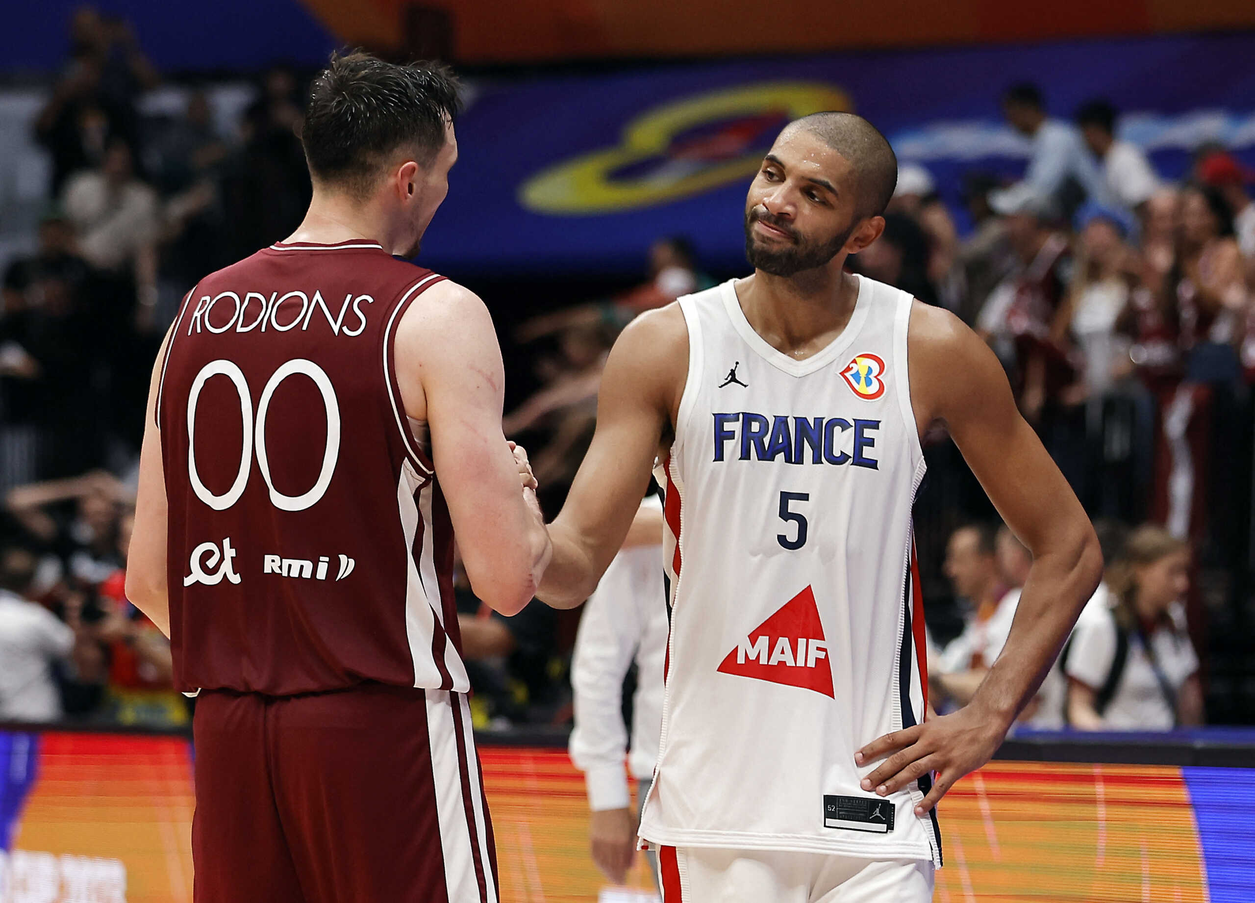 Basketball - FIBA World Cup 2023 - First Round - Group H - France v Latvia - Indonesia Arena, Jakarta, Indonesia - August 27, 2023 Latvia's Rodions Kurucs shakes hands with France's Nicolas Batum after the match REUTERS
