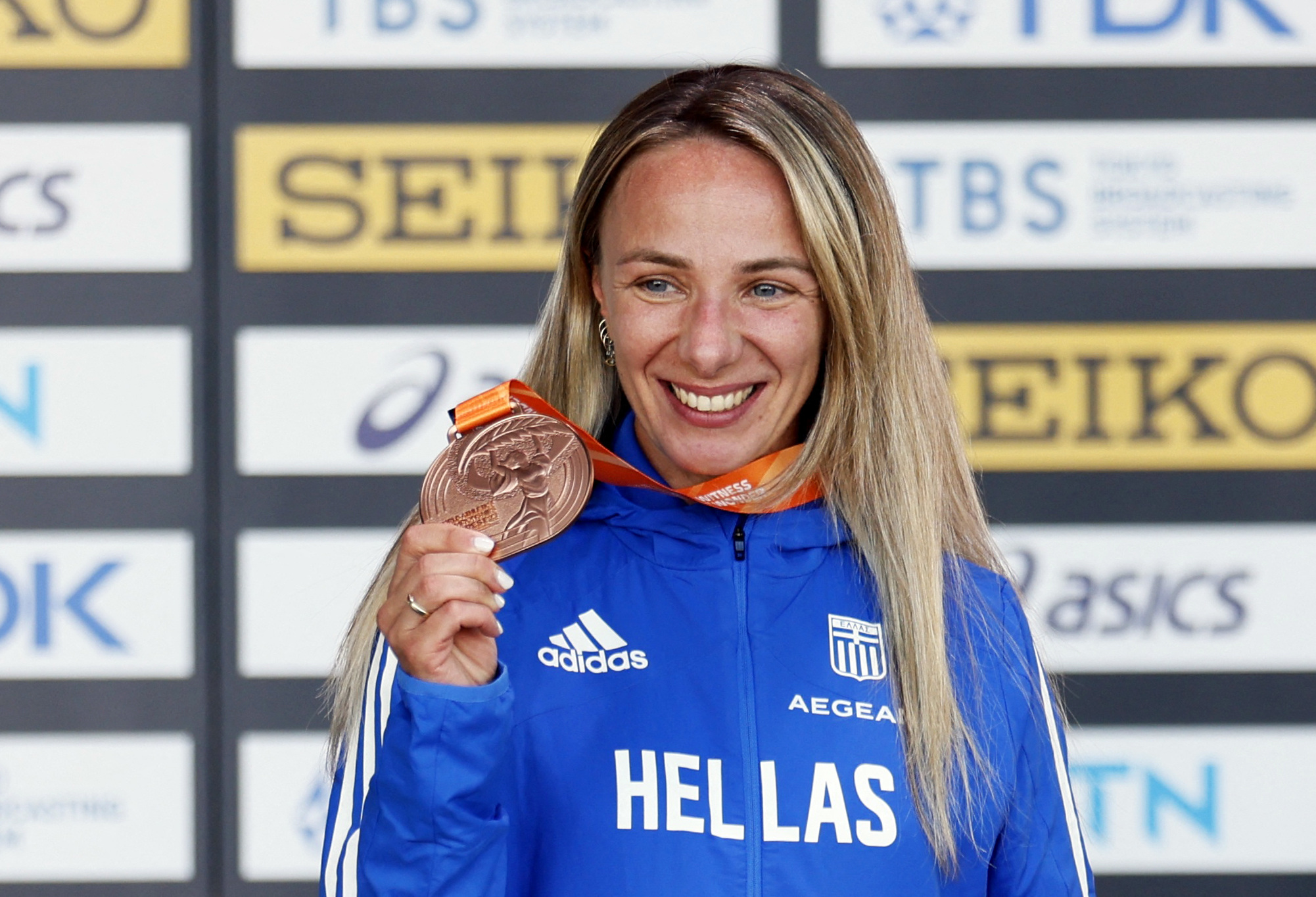 Athletics - World Athletics Championship - Women's 35 km Race Walk - National Athletics Centre, Budapest, Hungary - August 24, 2023  Bronze medallist Greece's Antigoni Ntrismpioti celebrates with her medal after the women's 35 km REUTERS