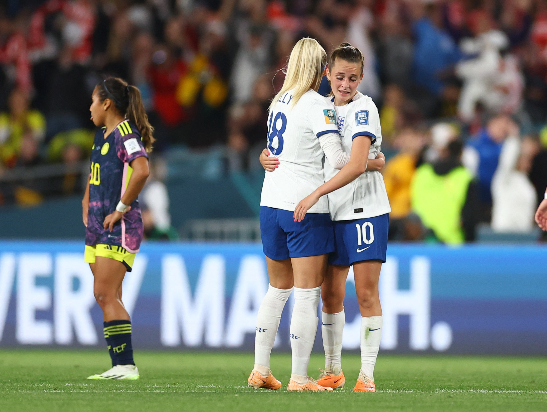 Soccer Football - FIFA Women’s World Cup Australia and New Zealand 2023 - Quarter Final - England v Colombia - Stadium Australia, Sydney, Australia - August 12, 2023 England's Chloe Kelly and Ella Toone embrace after progressing to the semi finals of the World Cup REUTERS