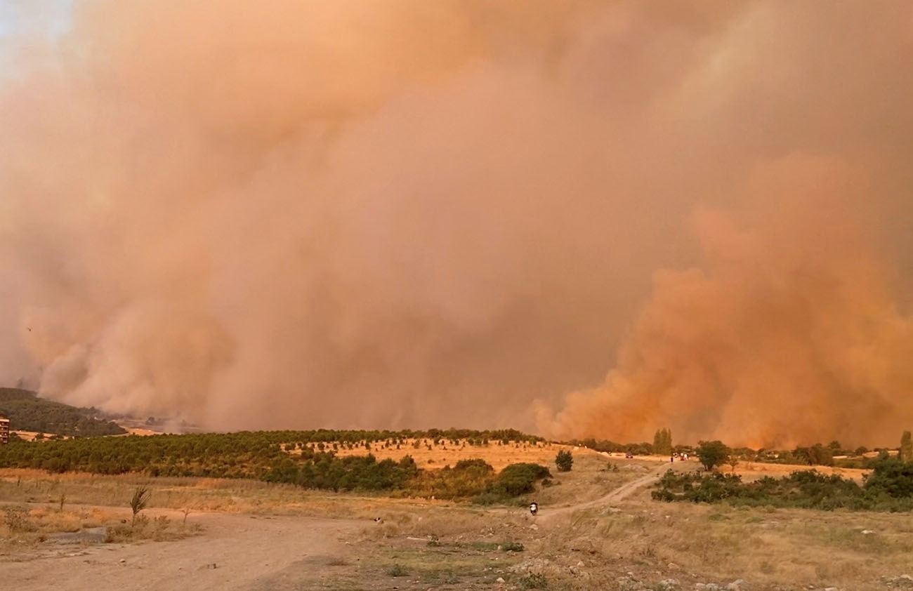 Smoke rises from burning wildfire in Canakkale, Turkey August 22, 2023 in this still image obtained from social media video. Atakan Uslu - Onedio