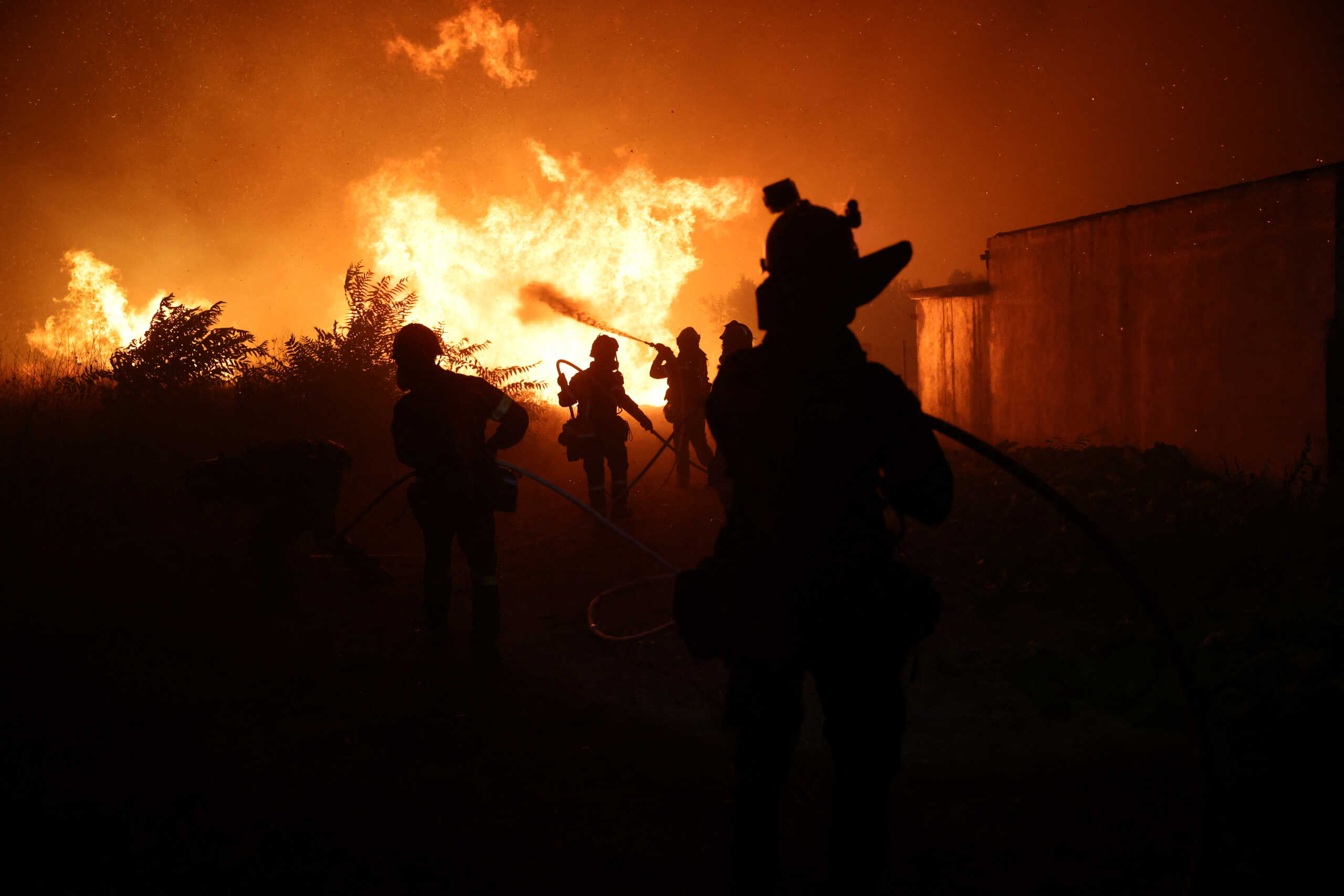 Firefighters try to extinguish a wildfire burning near the village of Makri on the region of Evros, Greece, August 22, 2023. REUTERS