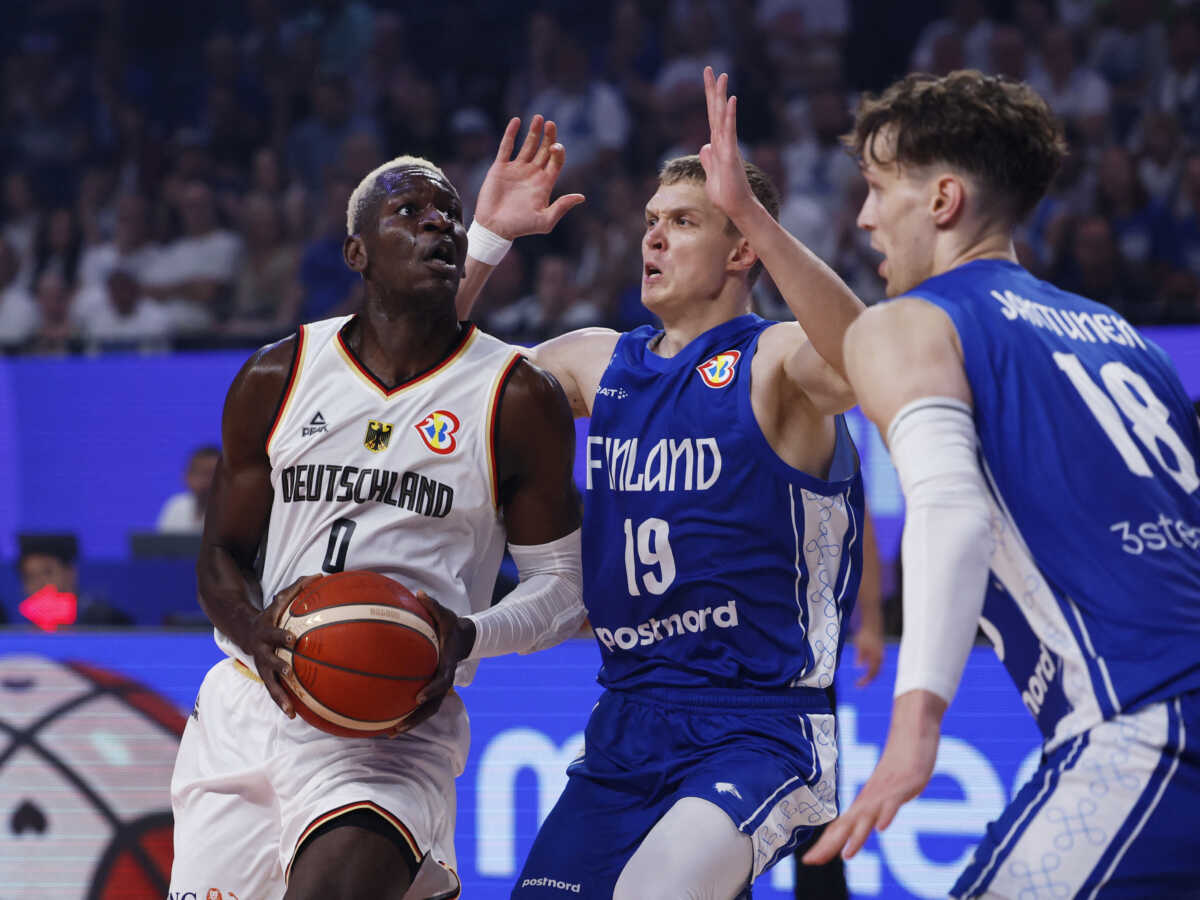 Basketball - FIBA World Cup 2023 - First Round - Group E - Germany v Finland - Okinawa Arena, Okinawa, Japan - August 29, 2023 Germany's Isaac Bonga in action with Finland's Elias Valtonen REUTERS