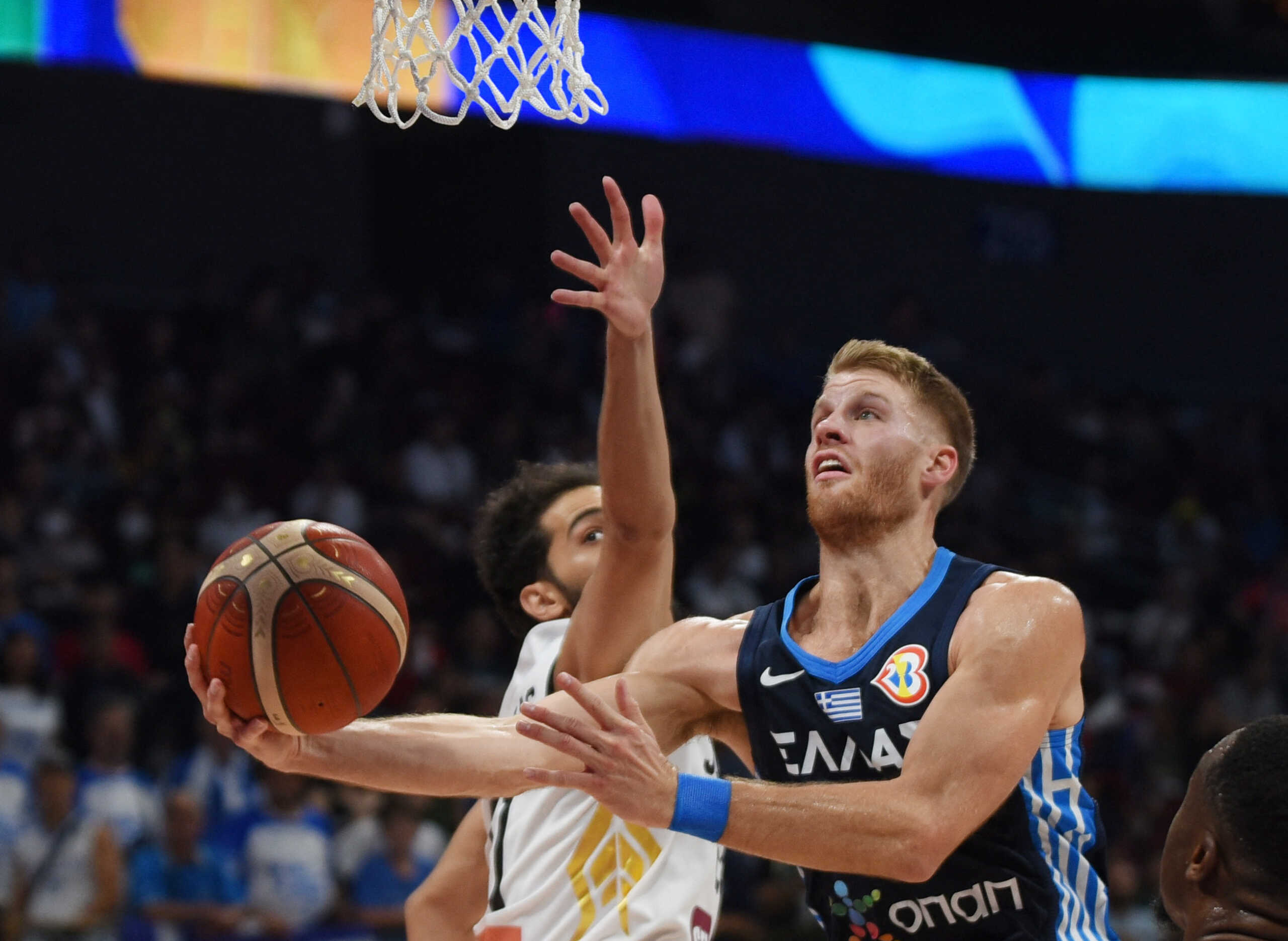 Basketball - FIBA World Cup 2023 - First Round - Group C - Jordan v Greece - Mall of Asia Arena, Manila, Philippines - August 26, 2023 Greece's Thomas Walkup in action with Jordan's Hashem Abbas REUTERS