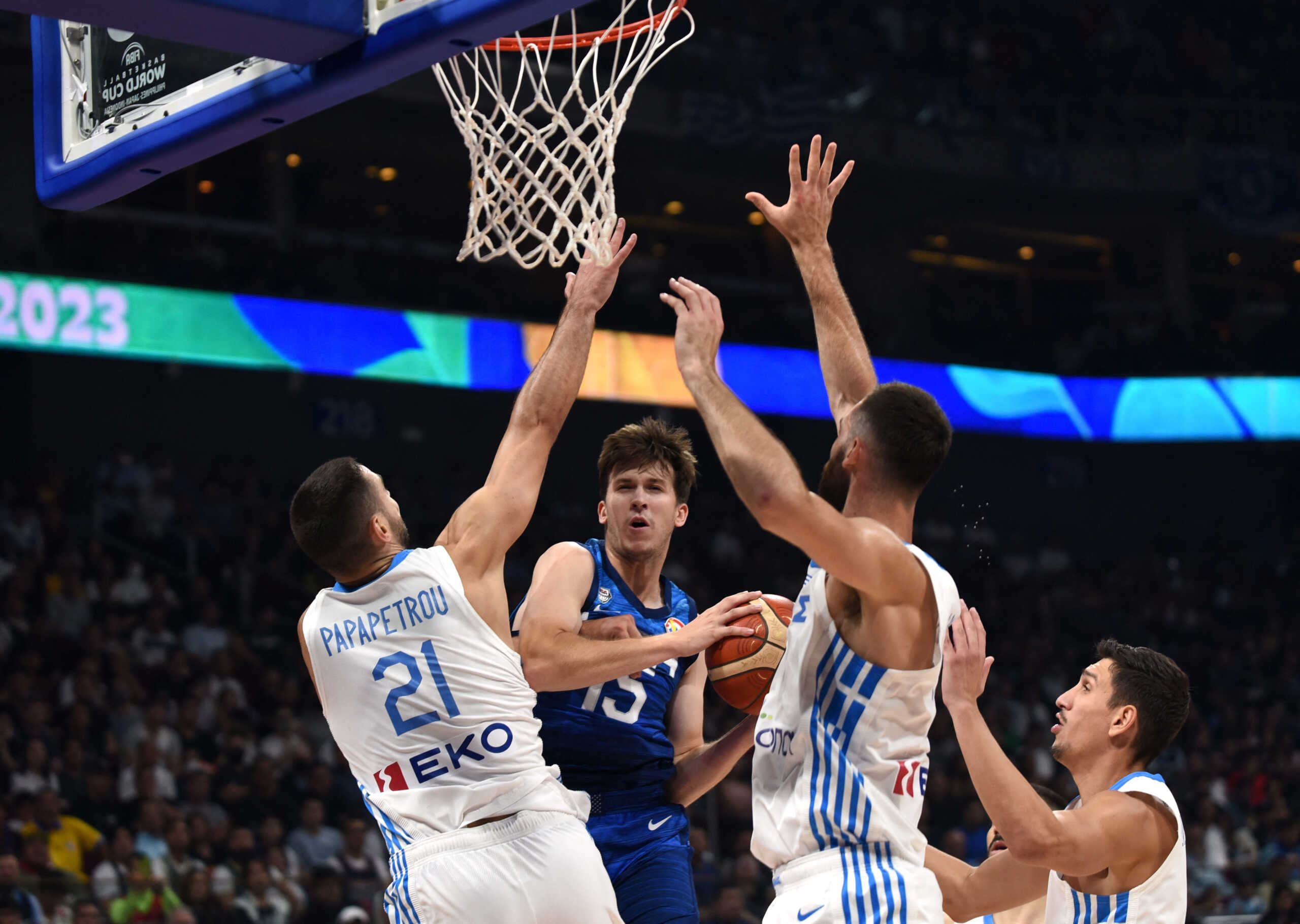 Basketball - FIBA World Cup 2023 - First Round - Group C - Greece v United States of America - Mall of Asia Arena, Manila, Philippines - August 28, 2023 Austin Reaves of the U.S. in action with Greece's Ioannis Papapetrou REUTERS