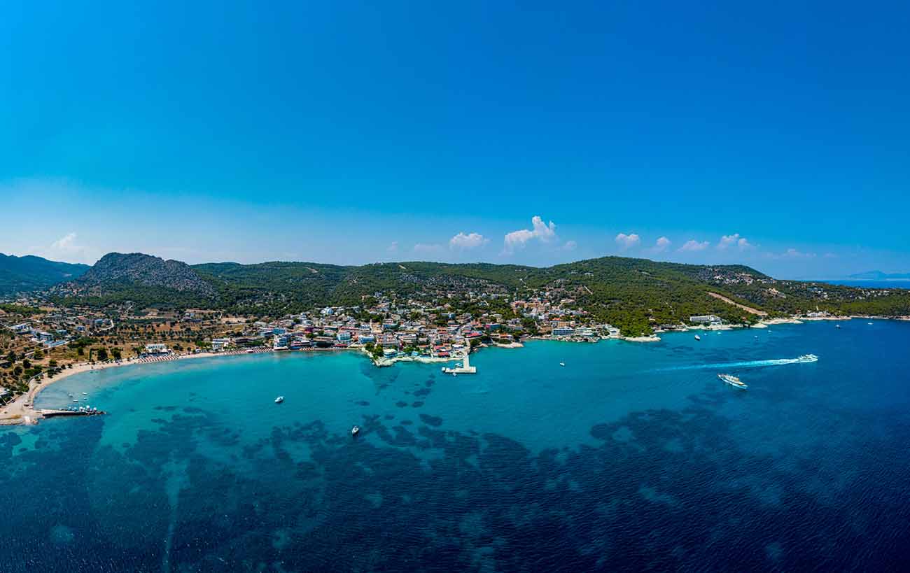Aegina, Egina, aerial panoramic photo of the town, port and beach of Agia Marina at summer