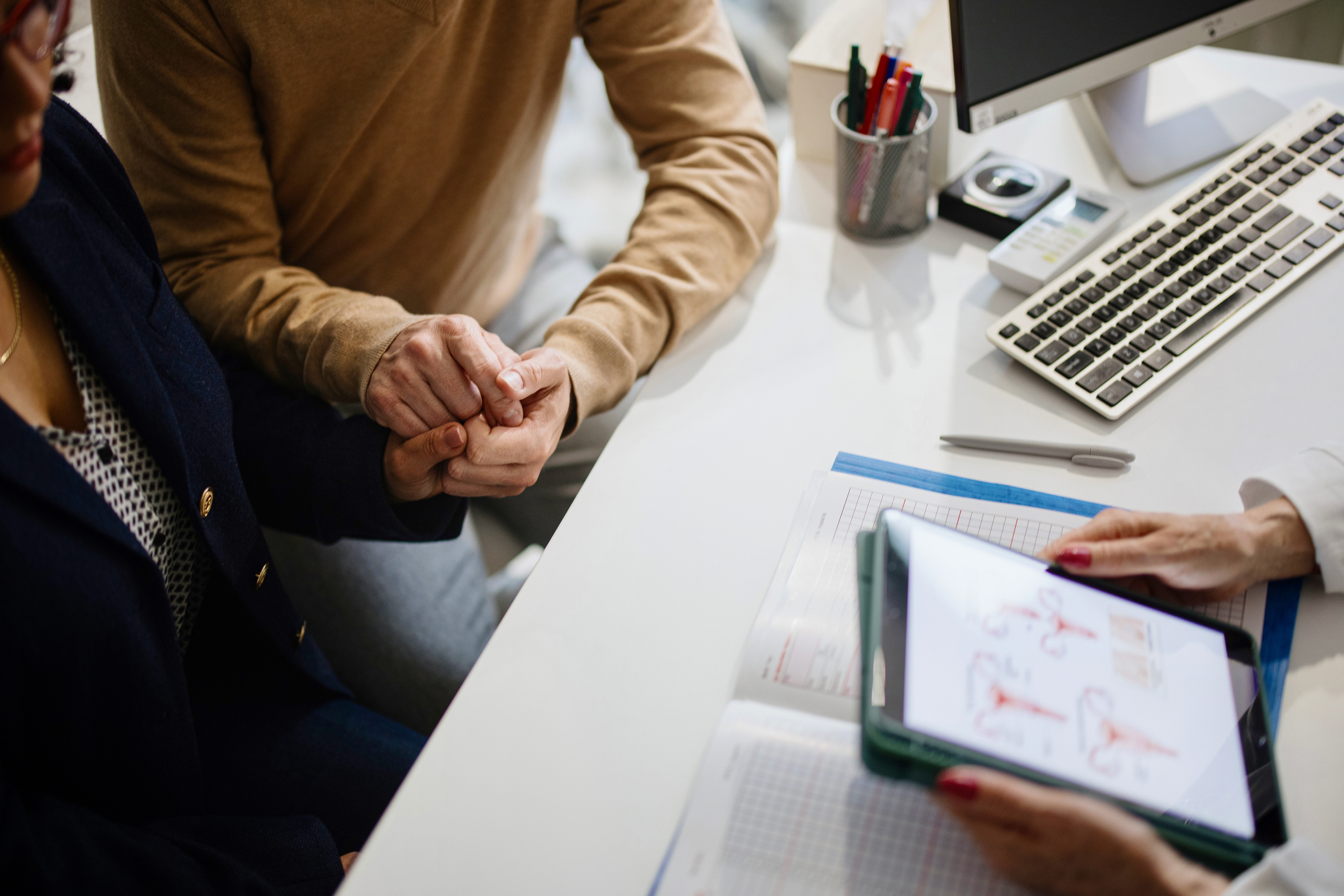 Patient couple having doctor or psychologist consulting on marriage, fertility treatment for infertility
