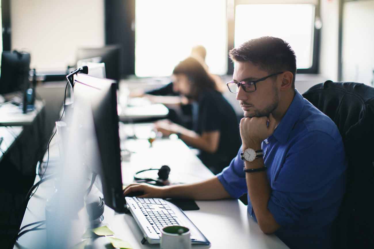 Computer programmer working on new software program.