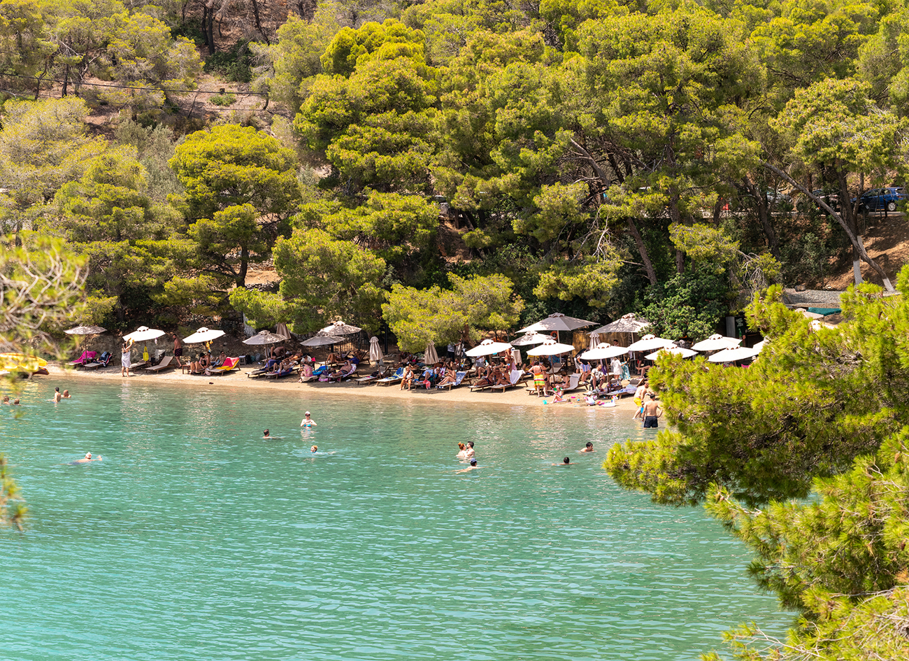 Love bay beach with local people and tourists enjoying summer.