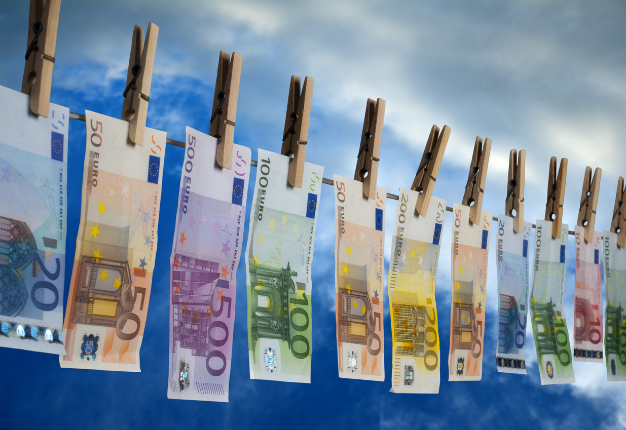 Euro notes with different value hanging on a line for drying