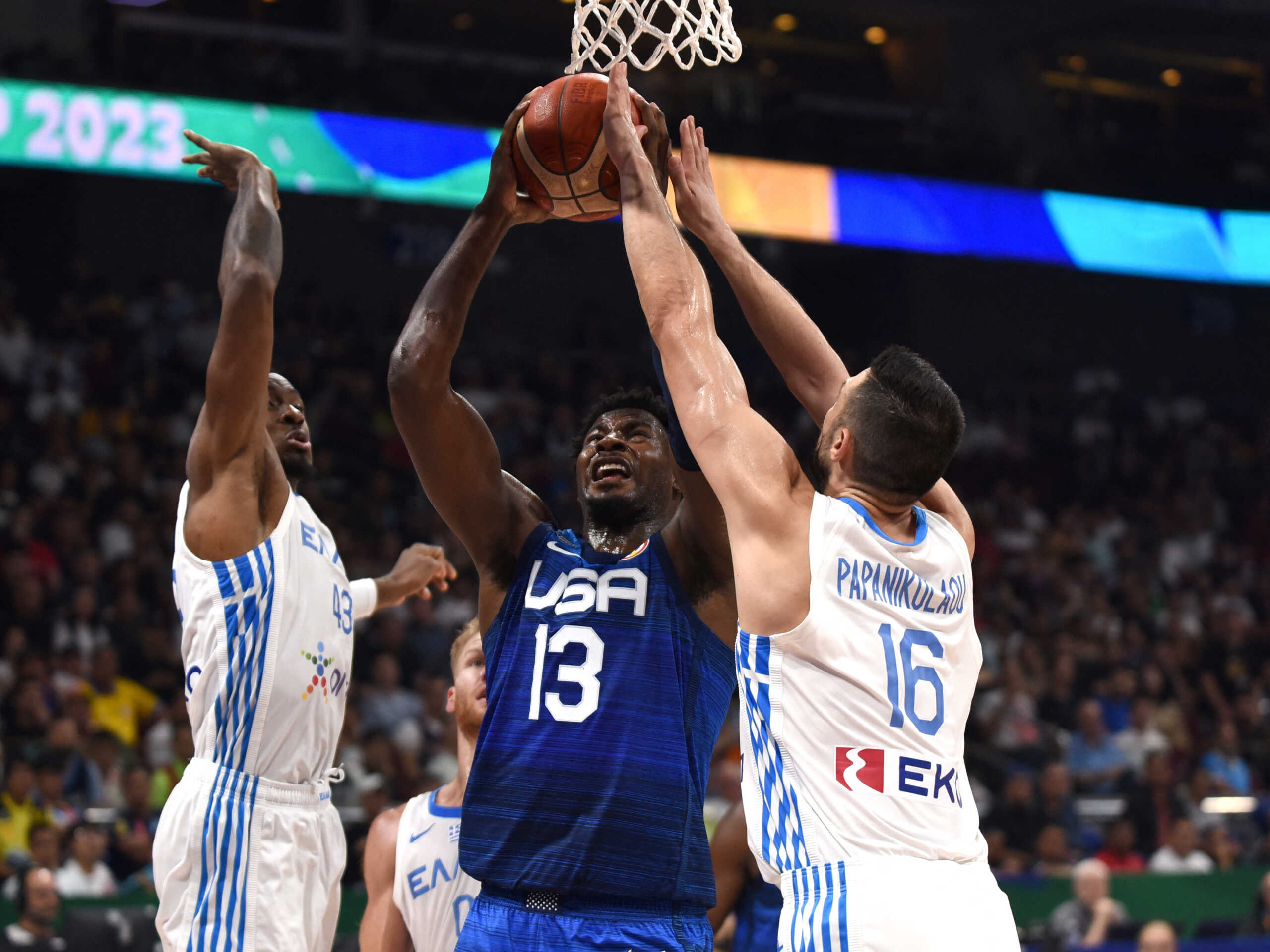 Basketball - FIBA World Cup 2023 - First Round - Group C - Greece v United States of America - Mall of Asia Arena, Manila, Philippines - August 28, 2023 Jaren Jackson Jr of the U.S. in action with Greece's Thanasis Antetokounmpo and Kostas Papanikolaou REUTERS