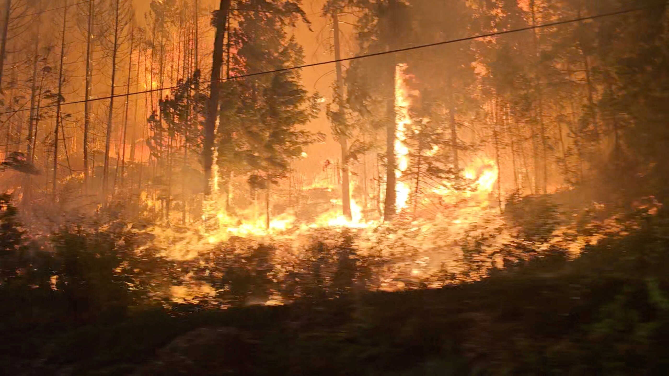 A view of fire close to highway near Sorrento, British Columbia, Canada, August 18, 2023 in this screen grab obtained from social media video. Nikki Goyer