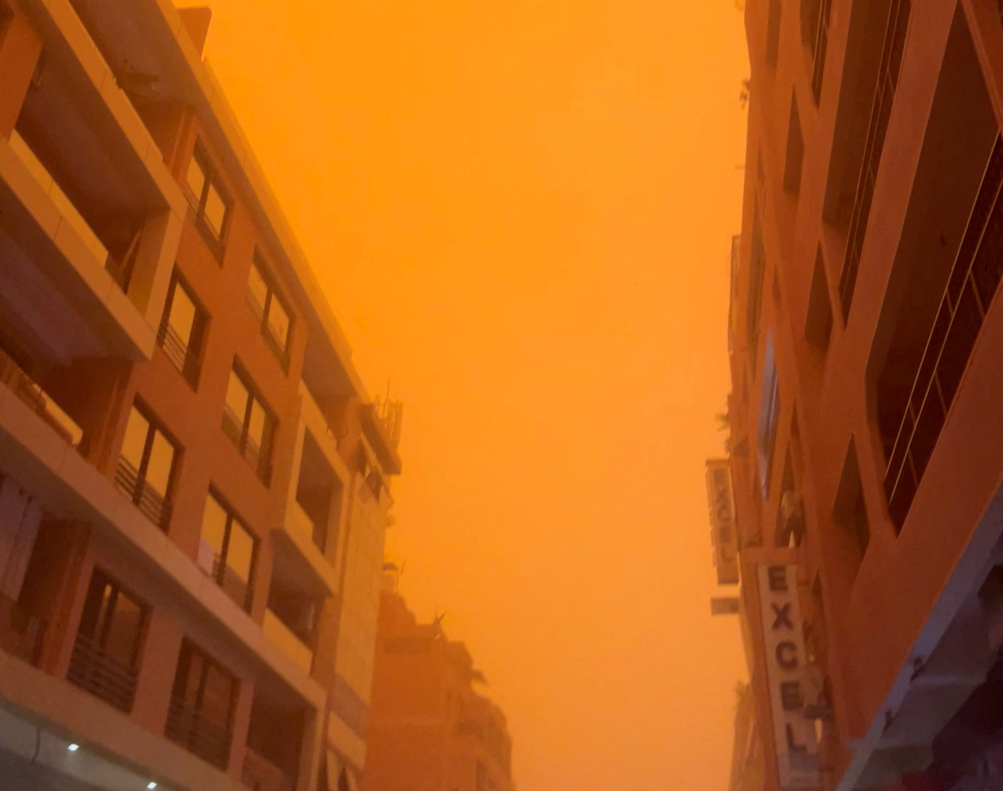 A view shows orange skies on the streets of Marrakesh from a sandstorm, Morocco, August 10, 2023, in this screen grab taken from a video. Jennifer Keeley