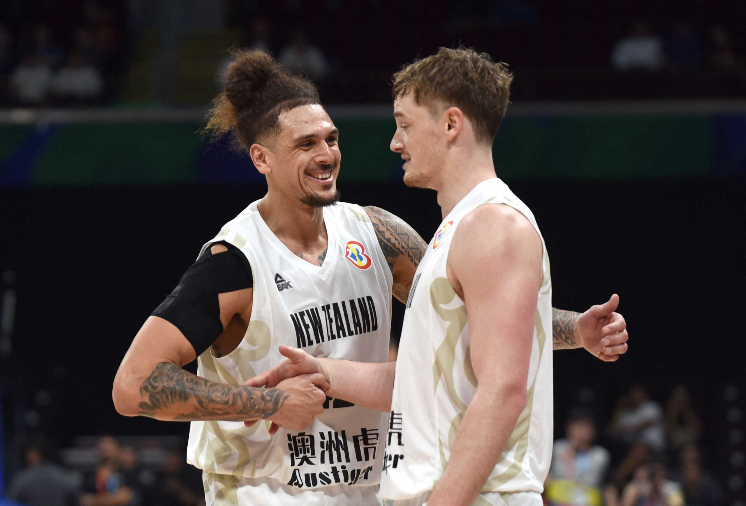 Basketball - FIBA World Cup 2023 - First Round - Group C - New Zealand v Jordan - Mall of Asia Arena, Manila, Philippines - August 28, 2023 New Zealand's Isaac Fotu celebrates with his teammate after winning the match REUTERS