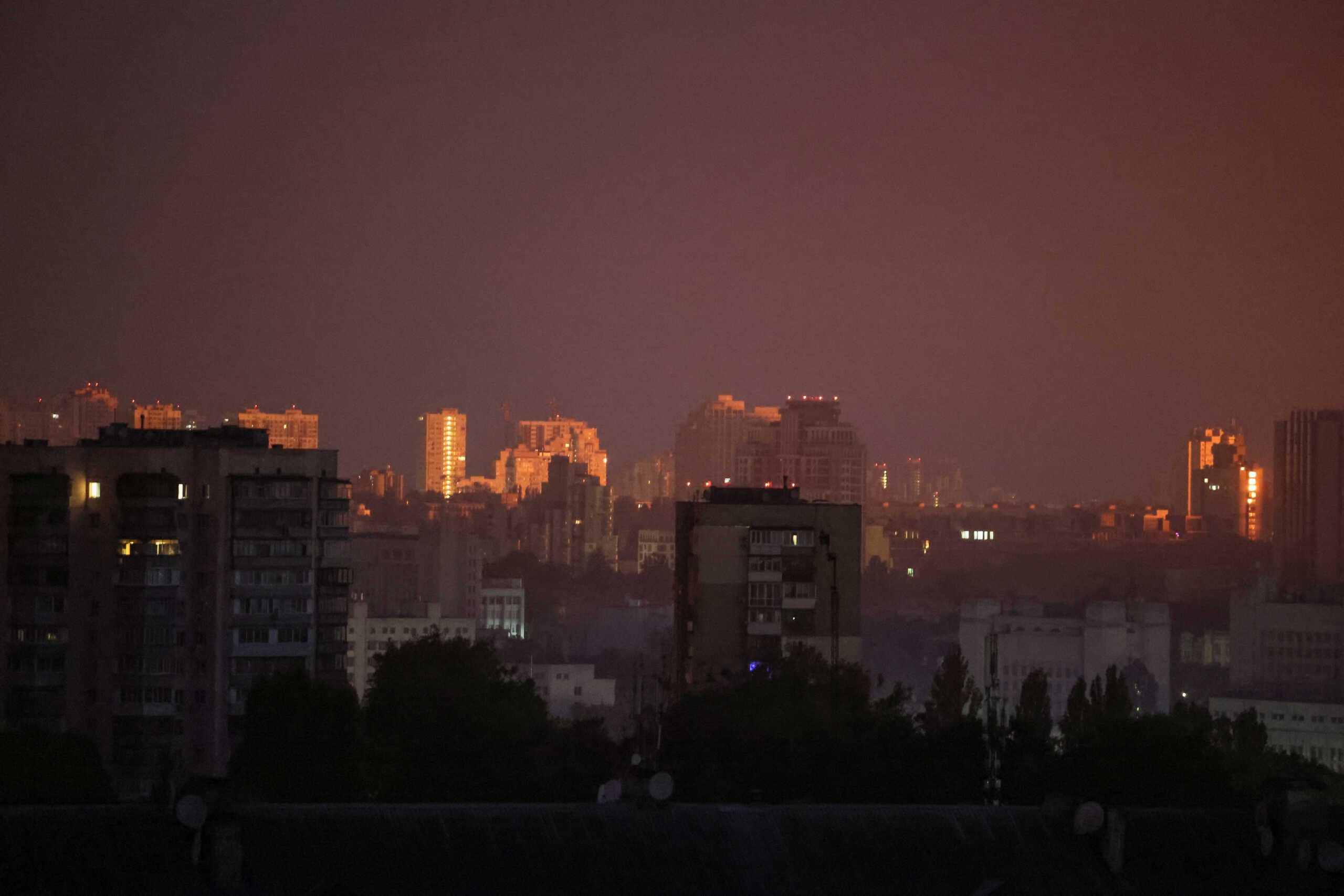 A flash from the explosion of a missile illuminates the city during a Russian missile strike, amid Russia's attack on Ukraine, in Kyiv, Ukraine August 30, 2023. REUTERS