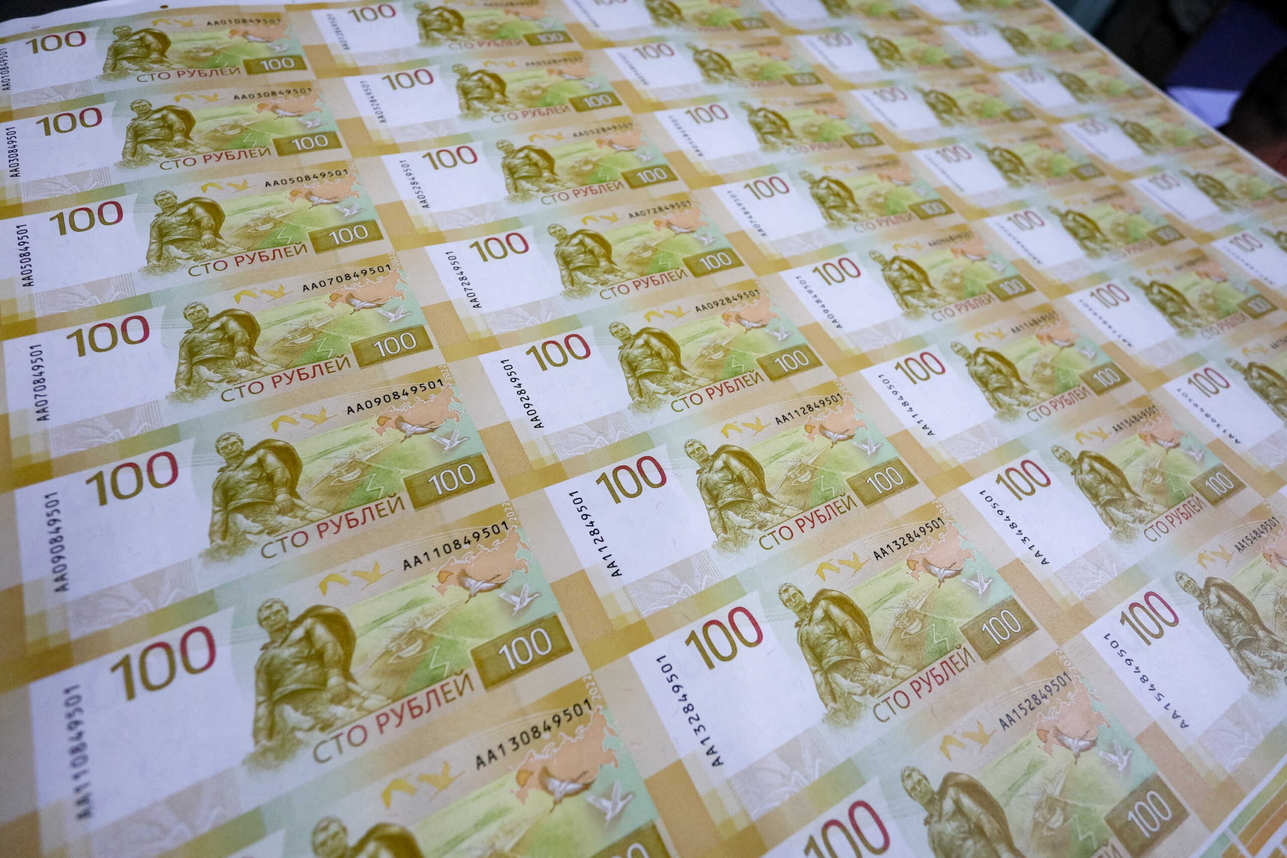 FILE PHOTO: Sheets of the newly designed Russian 100-rouble banknotes are seen at the Goznak printing factory in Moscow, Russia July 6, 2022. Moscow News Agency