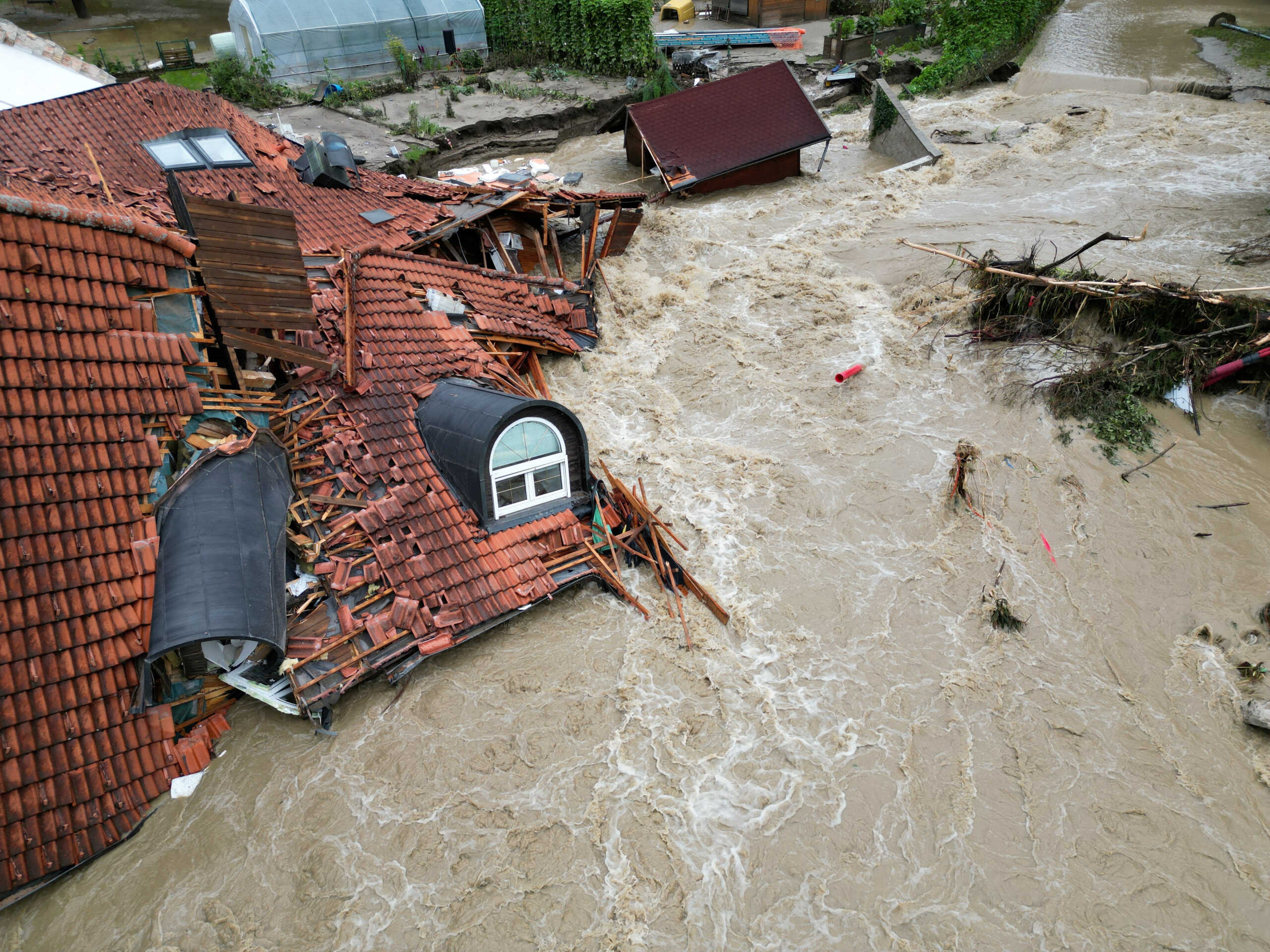 A view of a damaged building in a flooded area, following heavy rains, in Prevalje, Slovenia August 6, 2023.   REUTERS
