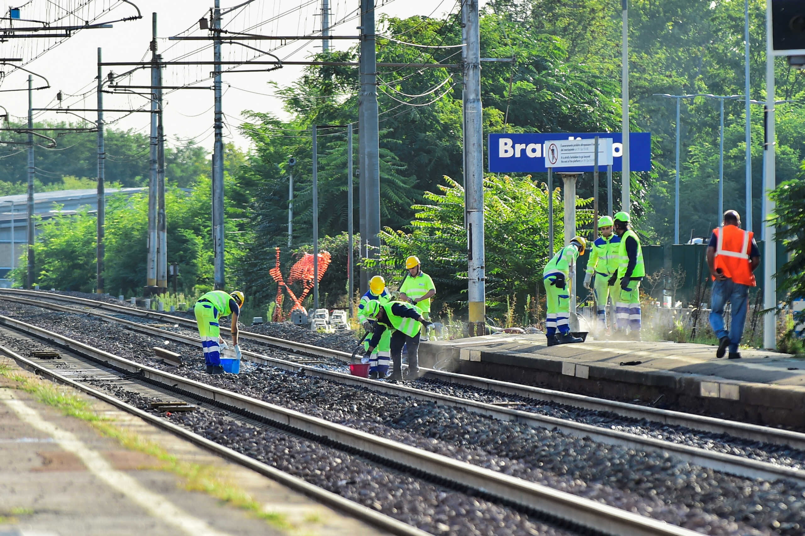 Officials work on rail tracks at the site of a train accident in which workers were killed, in Brandizzo, Italy, August 31, 2023. REUTERS