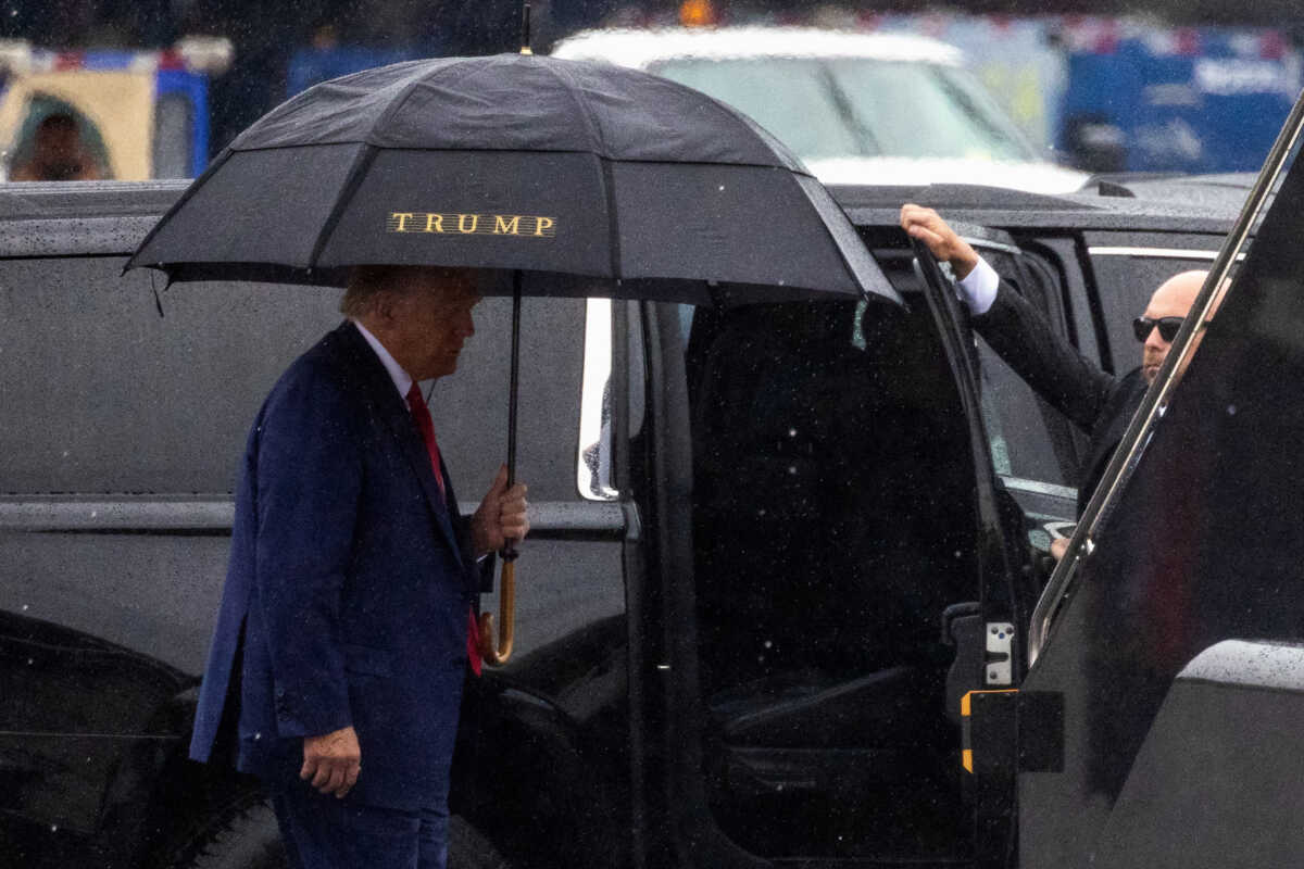 Former U.S. President Donald Trump, who was arraigned on federal charges related to attempts to overturn his 2020 election defeat, prepares to depart Washington at Reagan Washington National Airport in nearby Arlington, Virginia, U.S., August 3, 2023. REUTERS