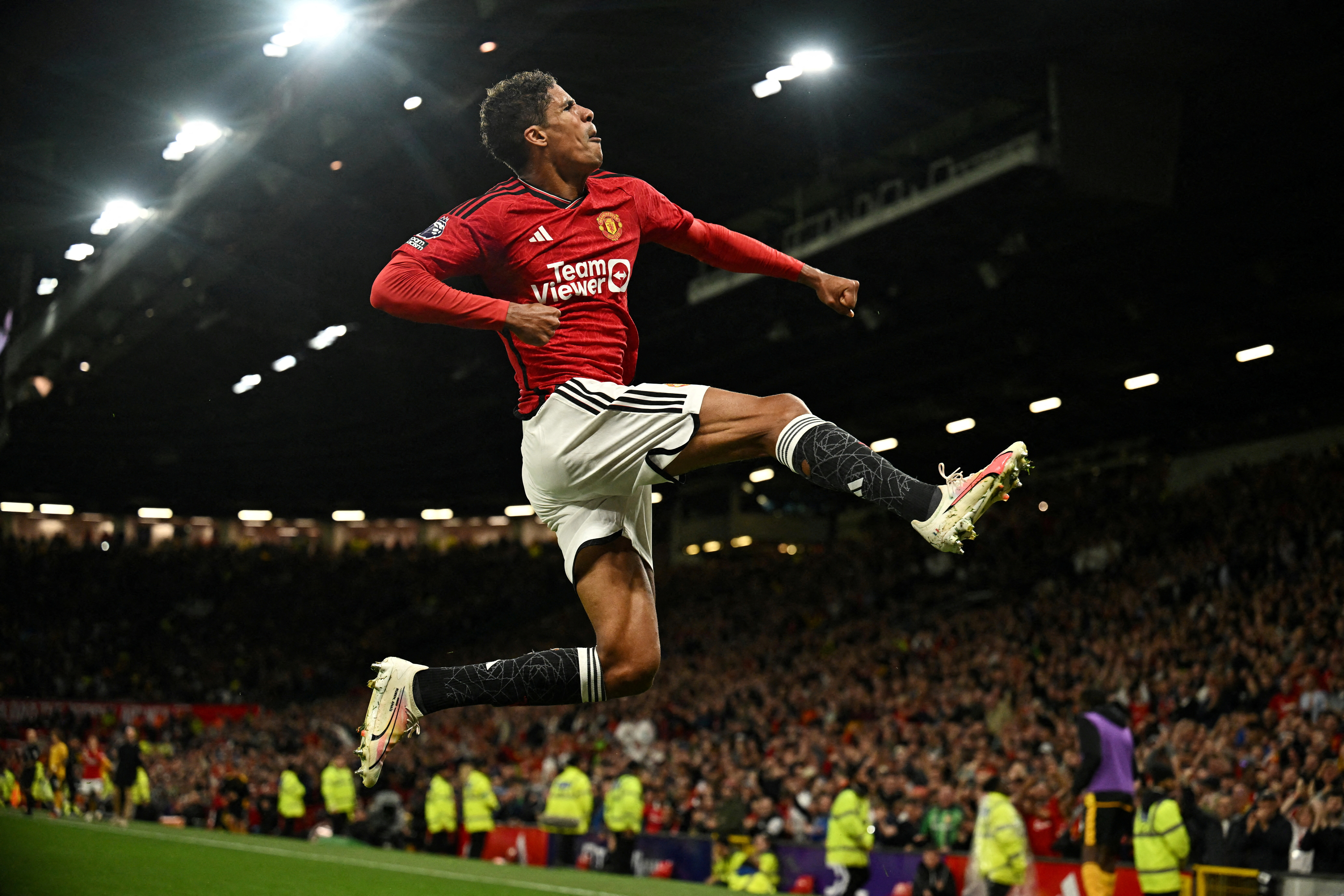 Soccer Football - Premier League - Manchester United v Wolverhampton Wanderers - Old Trafford, Manchester, Britain - August 14, 2023  Manchester United's Raphael Varane celebrates scoring their first goal REUTERS