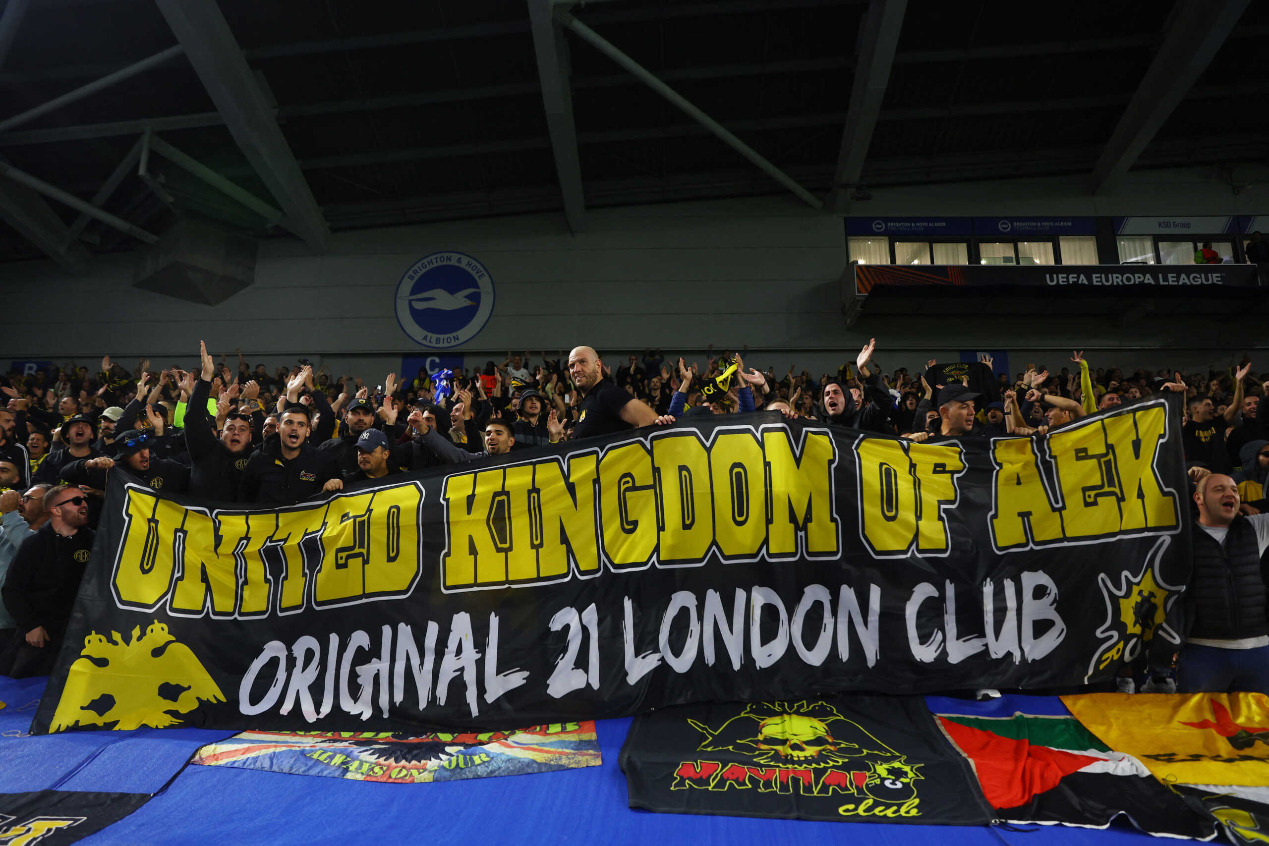 Soccer Football - Europa League - Group B - Brighton & Hove Albion v AEK Athens - The American Express Community Stadium, Brighton, Britain - September 21, 2023 AEK Athens fans with a banner inside the stadium before the match Action Images via Reuters