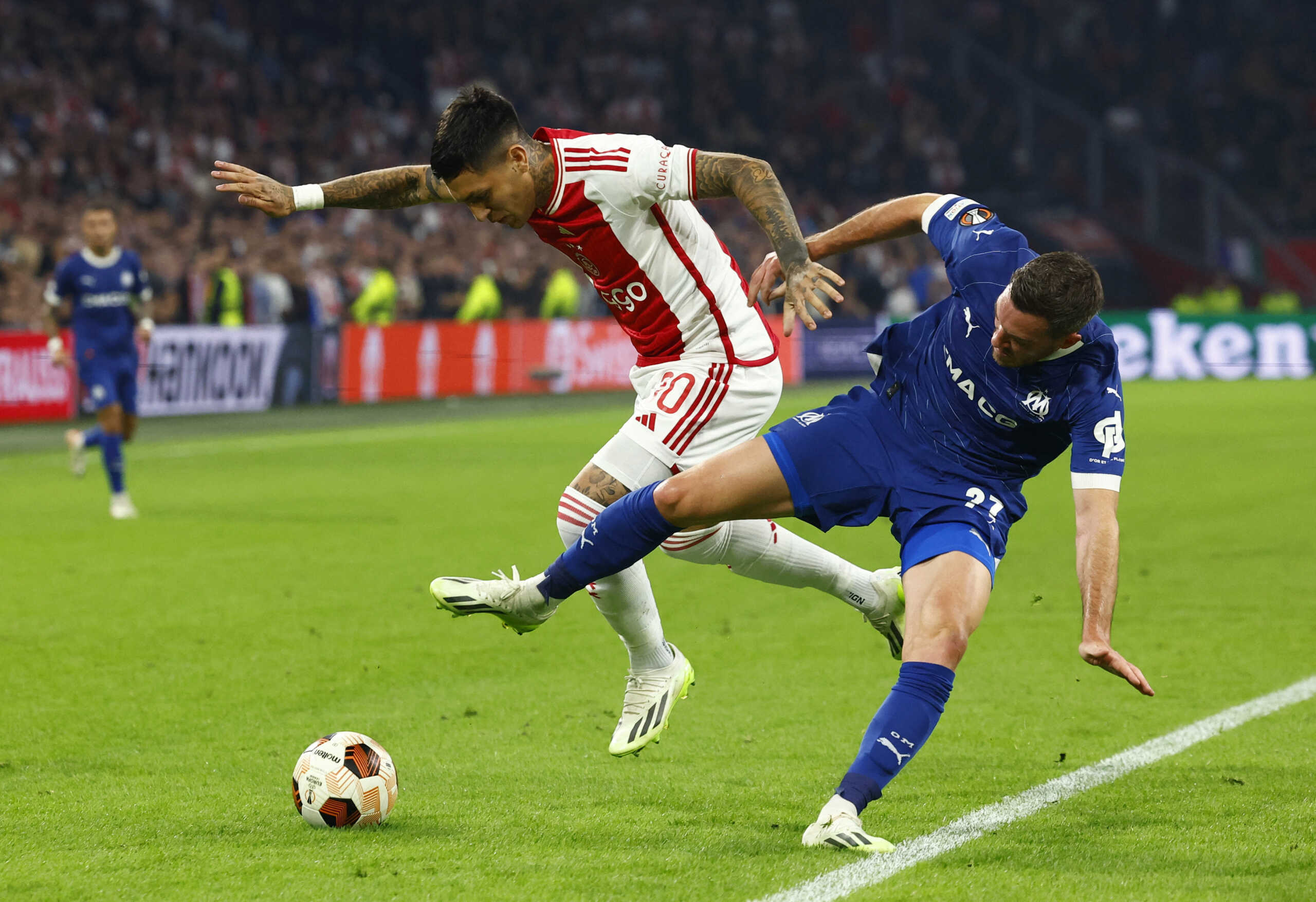 Soccer Football - Europa League - Group B - Ajax Amsterdam v Olympique de Marseille - Johan Cruijff Arena, Amsterdam, Netherlands - September 21, 2023 Ajax Amsterdam's Gaston Avila in action with Olympique de Marseille's Jordan Veretout REUTERS