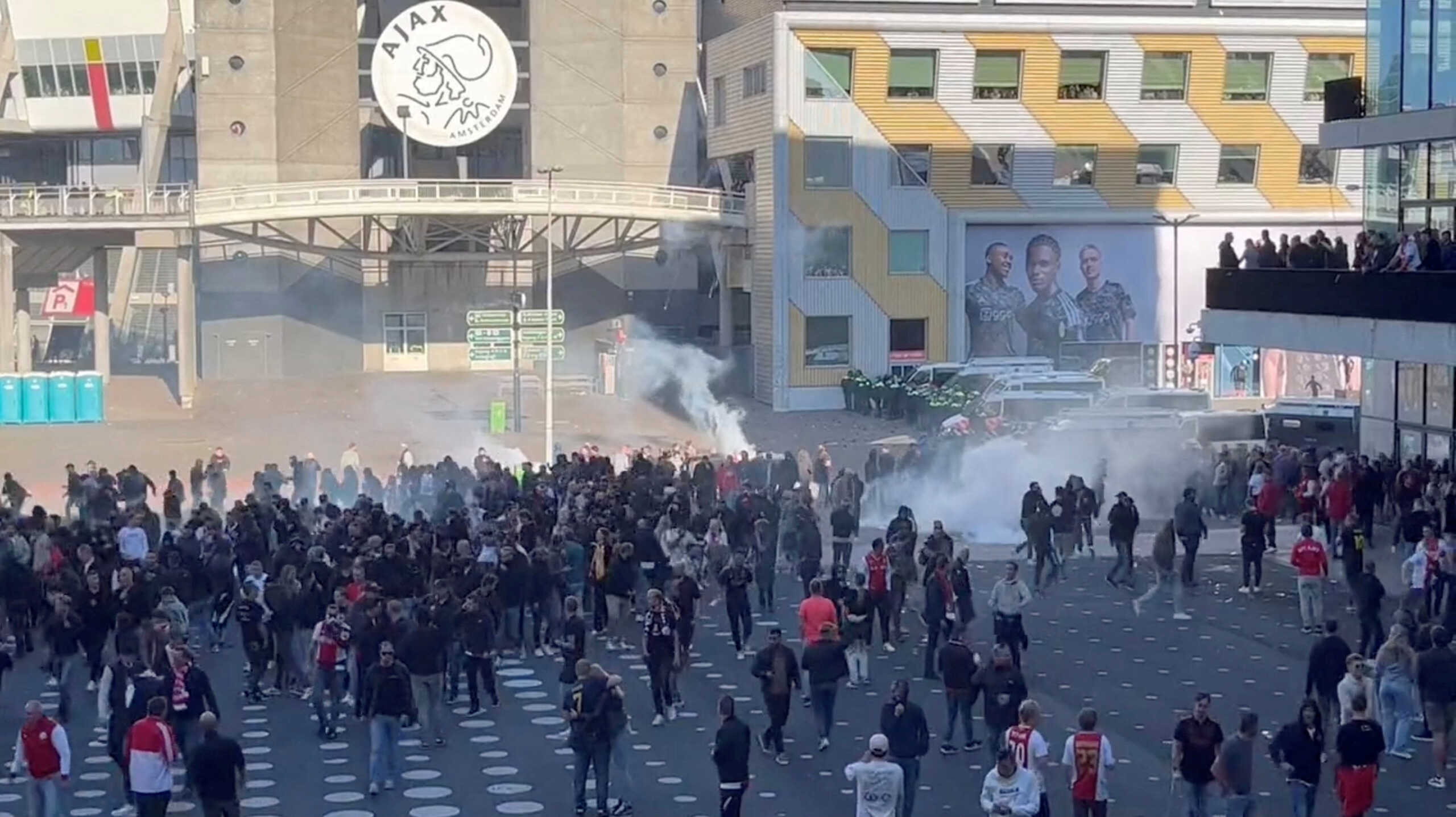 Police officers use teargas to disperse football fans rioting Johan Cruijff Arena, in Amsterdam, Netherlands, September 24, 2023, in this video screegrab obtained from social media. All About Ajax