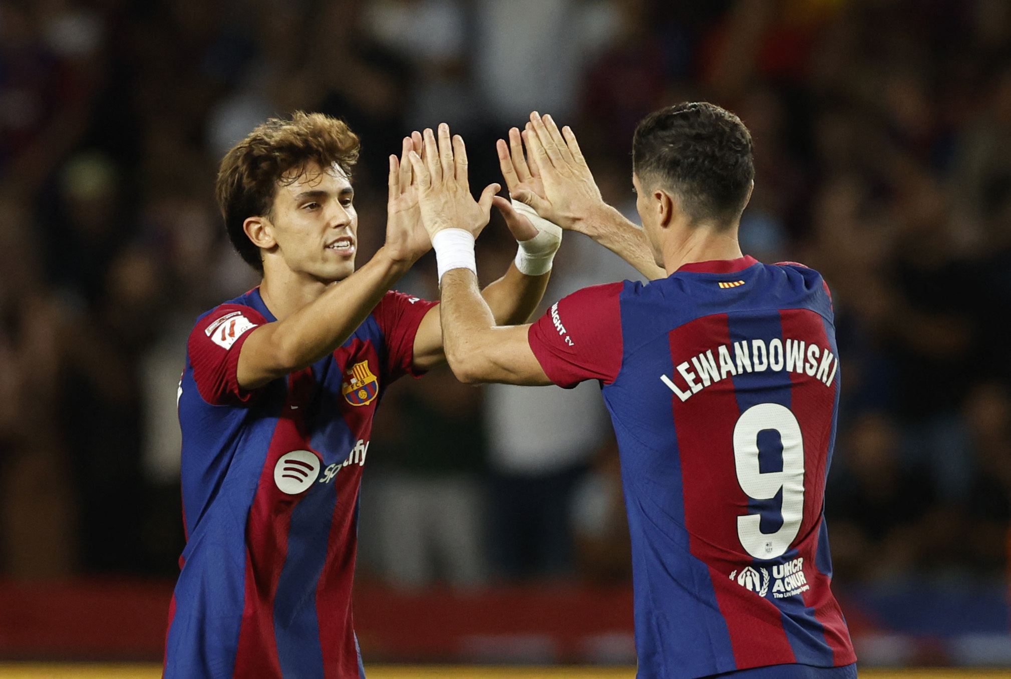 Soccer Football - LaLiga - FC Barcelona v Celta Vigo - Estadi Olimpic Lluis Companys, Barcelona, Spain - September 23, 2023 FC Barcelona's Robert Lewandowski celebrates scoring their first goal with teammate Joao Felix REUTERS