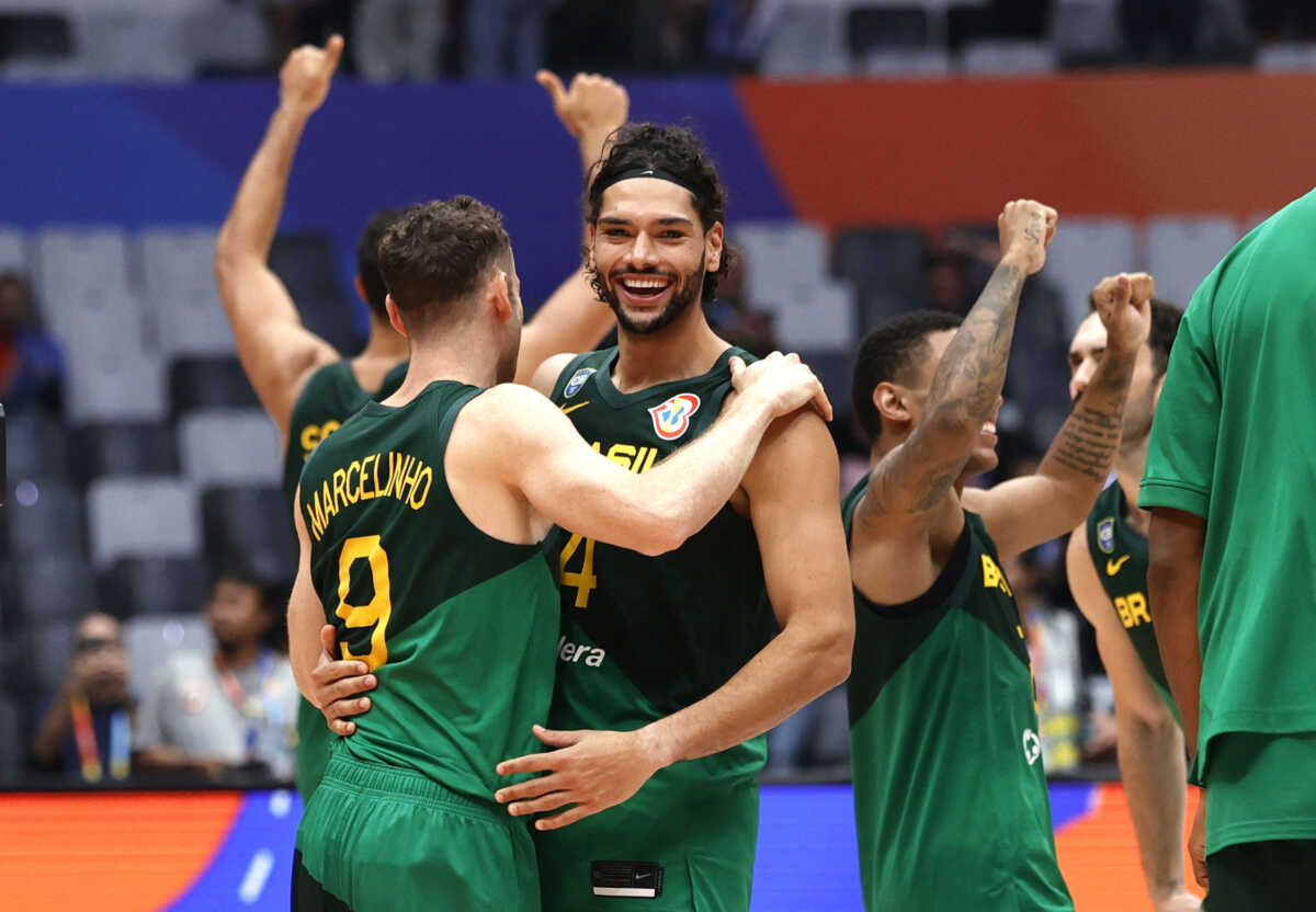 Basketball - FIBA World Cup 2023 - Second Round - Group L - Canada v Brazil - Indonesia Arena, Jakarta, Indonesia - September 1, 2023 Brazil's Leonardo Meindl and Marcelinho Huertas celebrate after the match REUTERS