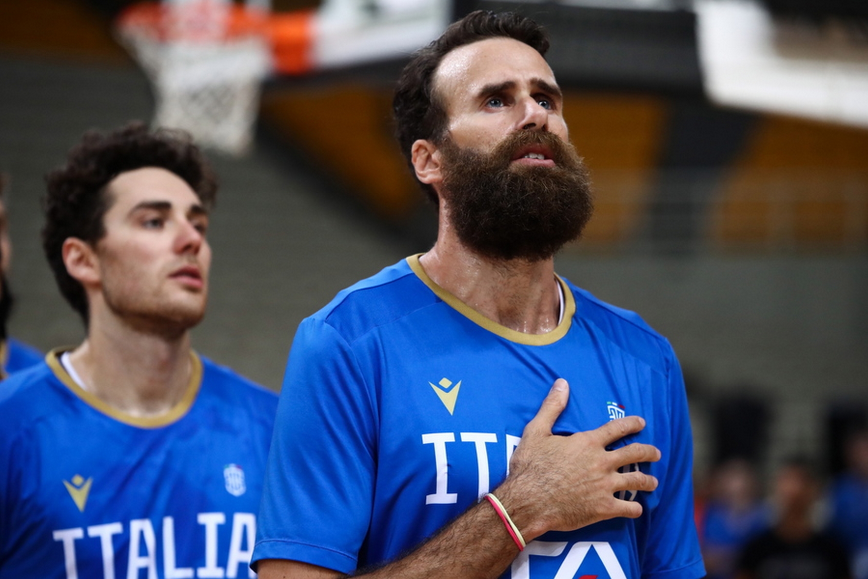 epa10792229 Italy’s player Luigi Datome (R) lines up for the national anthem before the Acropolis Tournament basketball match between Serbia and Italy, in Athens, Greece, 09 August 2023.  EPA
