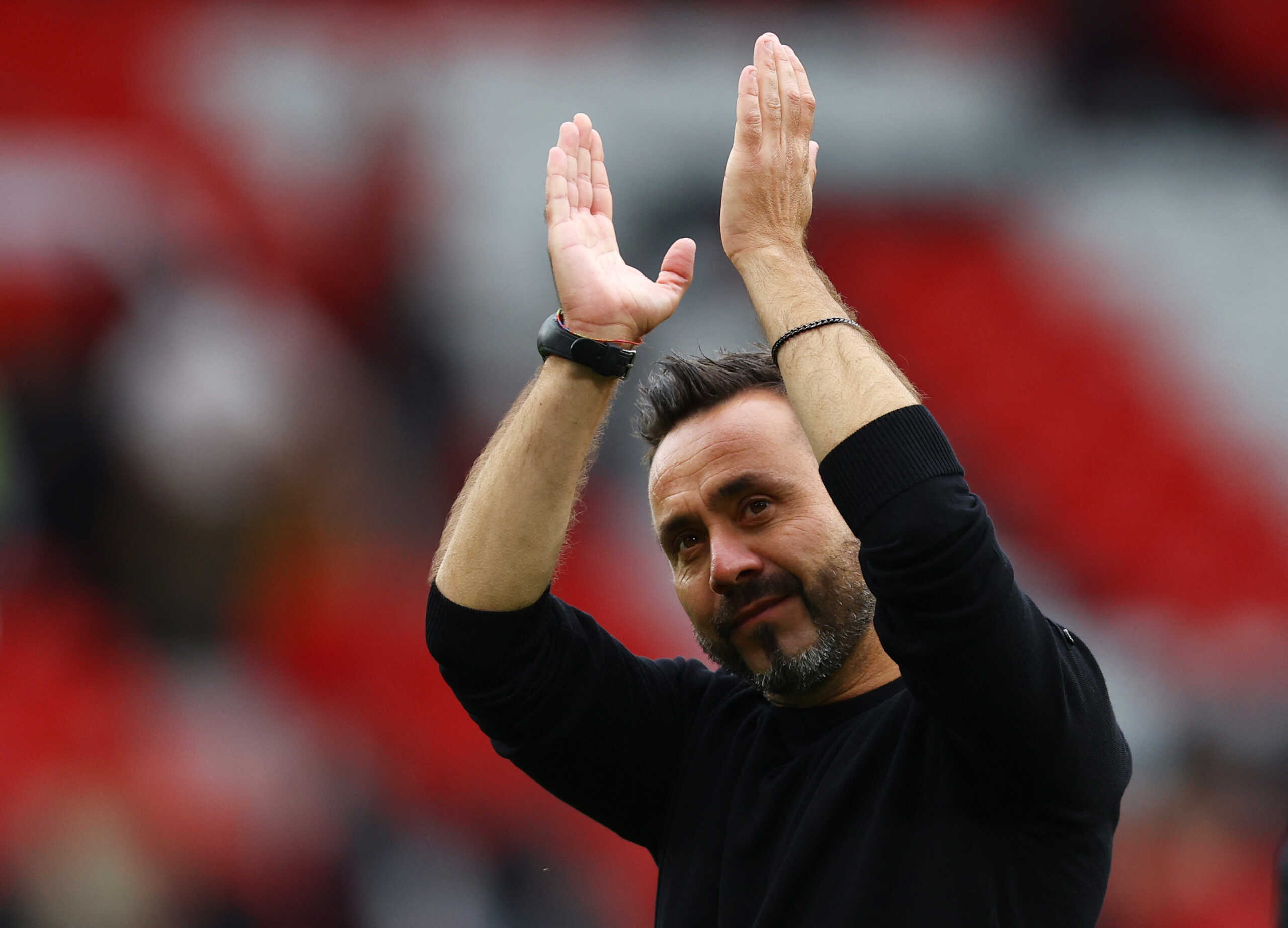 Soccer Football - Premier League - Manchester United v Brighton & Hove Albion - Old Trafford, Manchester, Britain - September 16, 2023 Brighton & Hove Albion manager Roberto De Zerbi celebrates after the match REUTERS