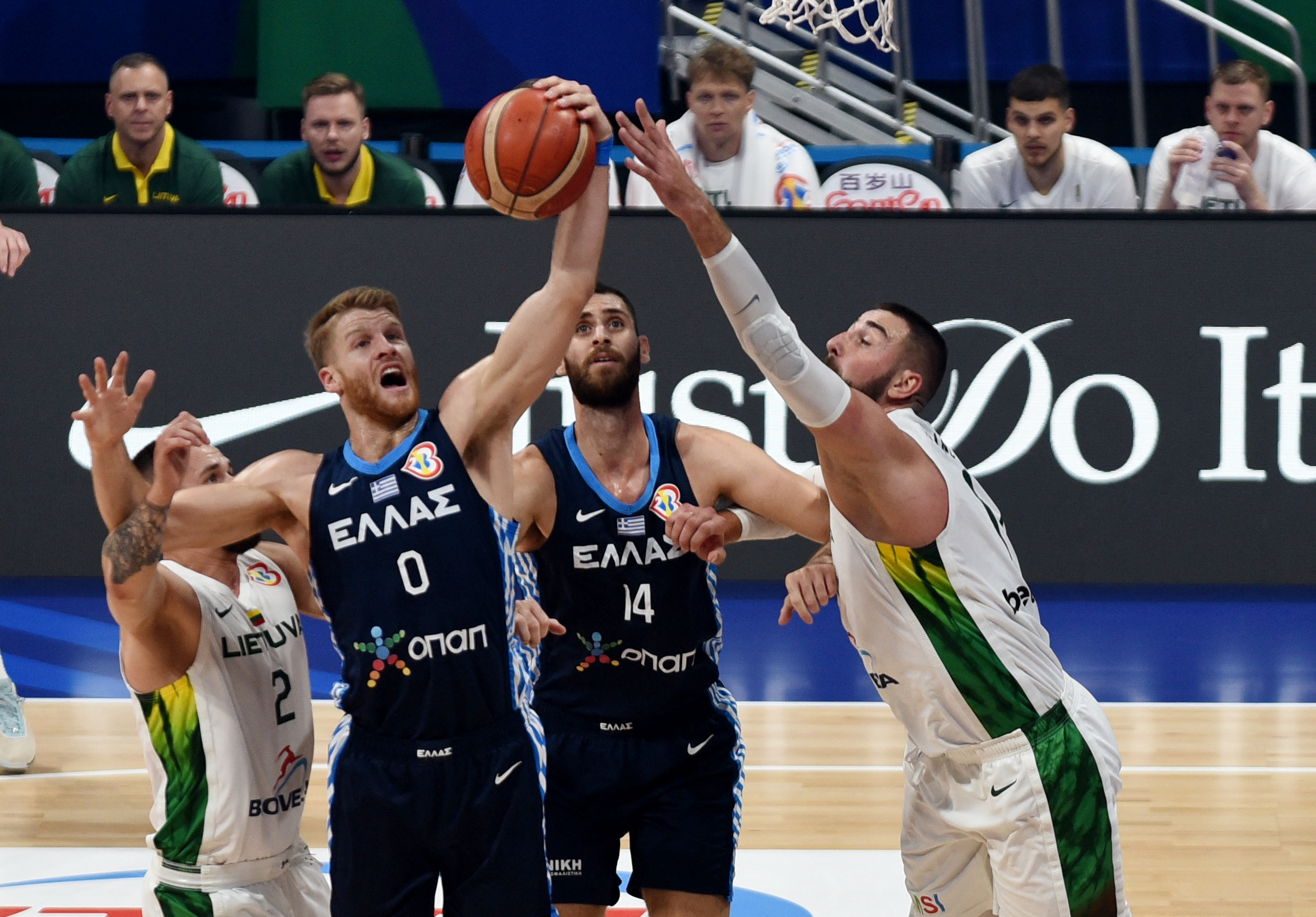 Basketball - FIBA World Cup 2023 - Second Round - Group J - Lithuania v Greece - Mall of Asia Arena, Manila, Philippines - September 1, 2023 Greece's Thomas Walkup and Greece's Georgios Papagiannis in action with Lithuania's Margiris Normantas REUTERS