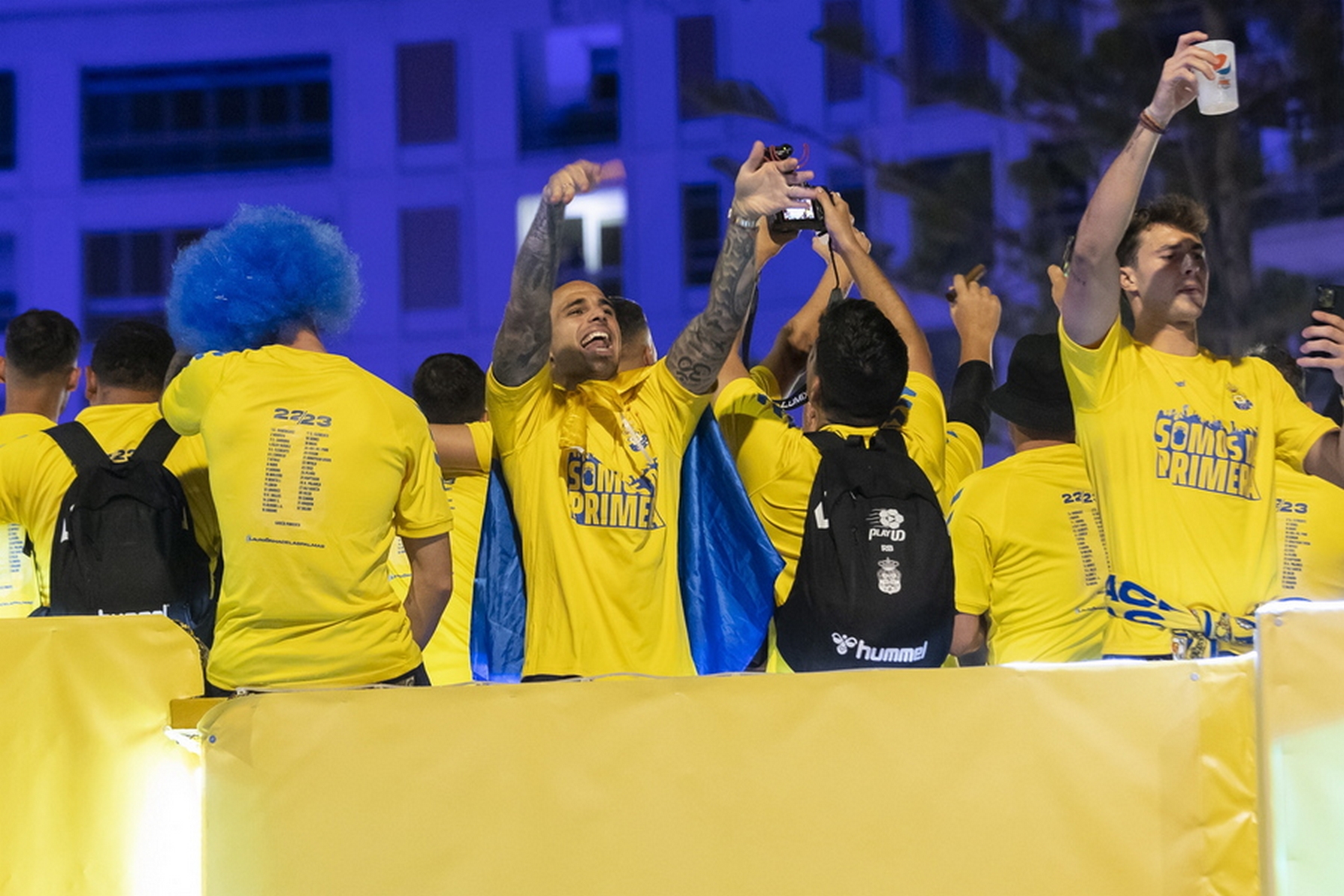 epa10659299 Players from the Union Deportiva Las Palmas celebrate at dawn with their fans the return of the team to the First Division, in the Plaza de Espana in the capital of Gran Canaria, Las Palmas, Spain, 28 May 2023.  EPA